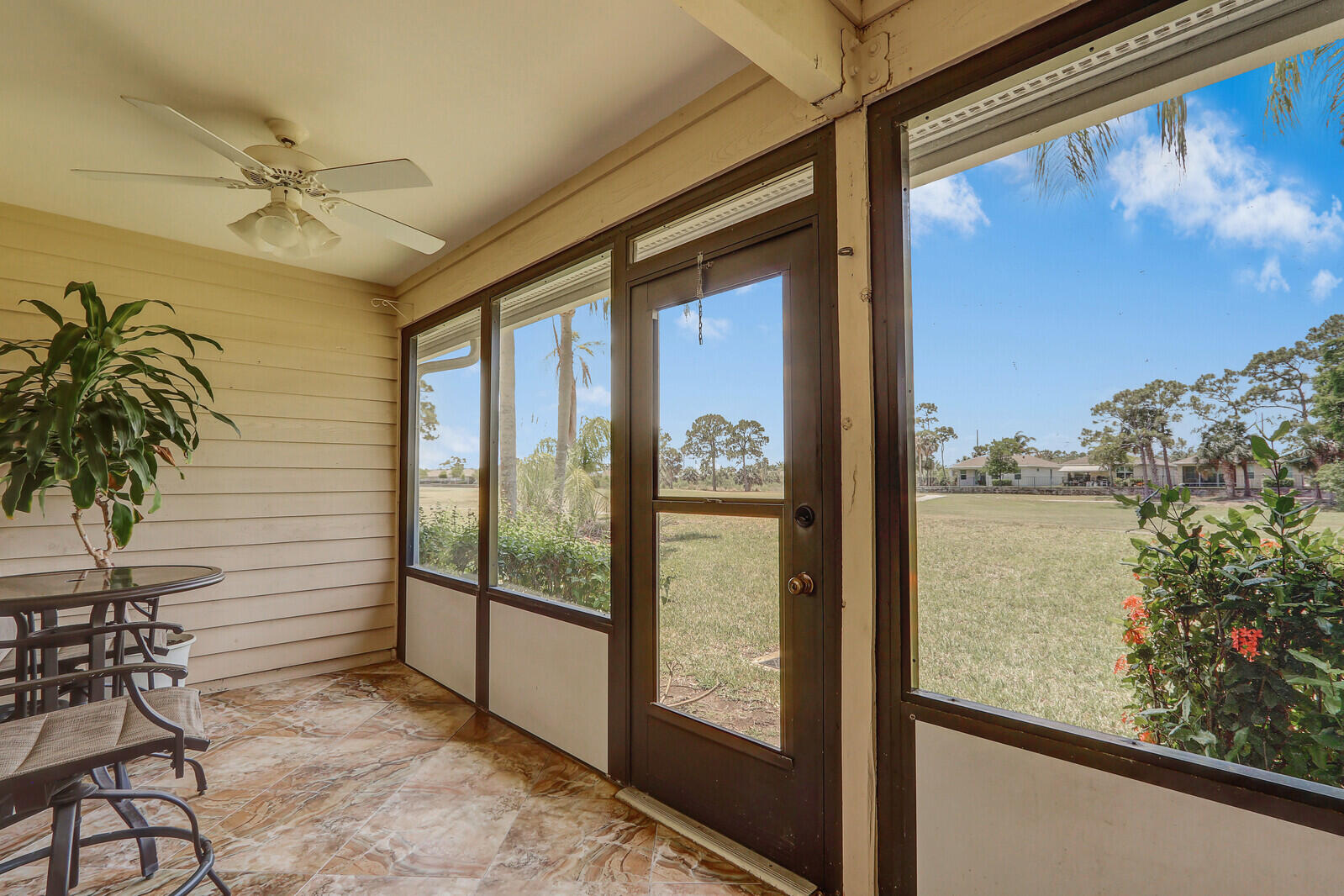 6148 Southeast Georgetown Place, Unit 805 Hobe Sound, FL 33455 - Photo 39 of 44 a view of a balcony with potted plants