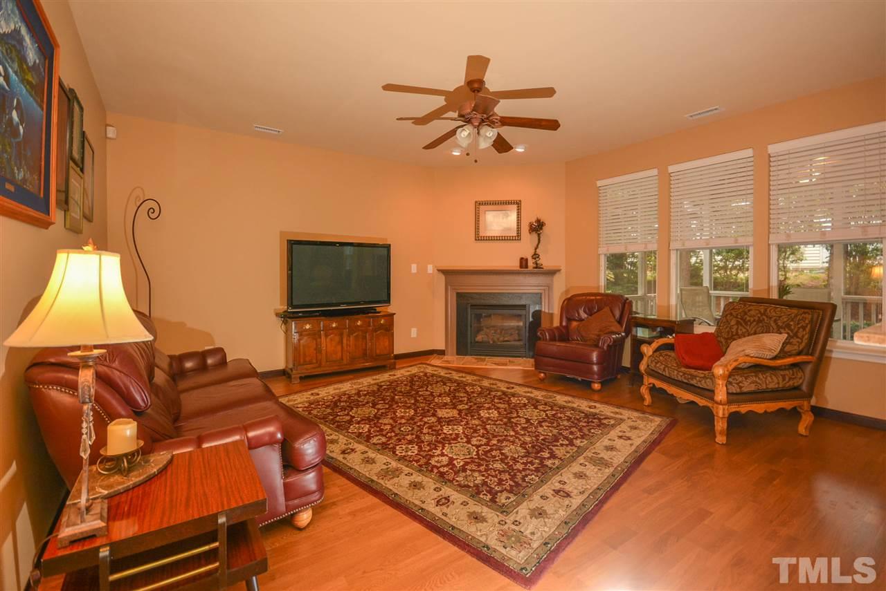 8502 Pillar Gate Lane Raleigh, NC 27613 - Photo 2 of 22 a living room with furniture a rug and a flat screen tv