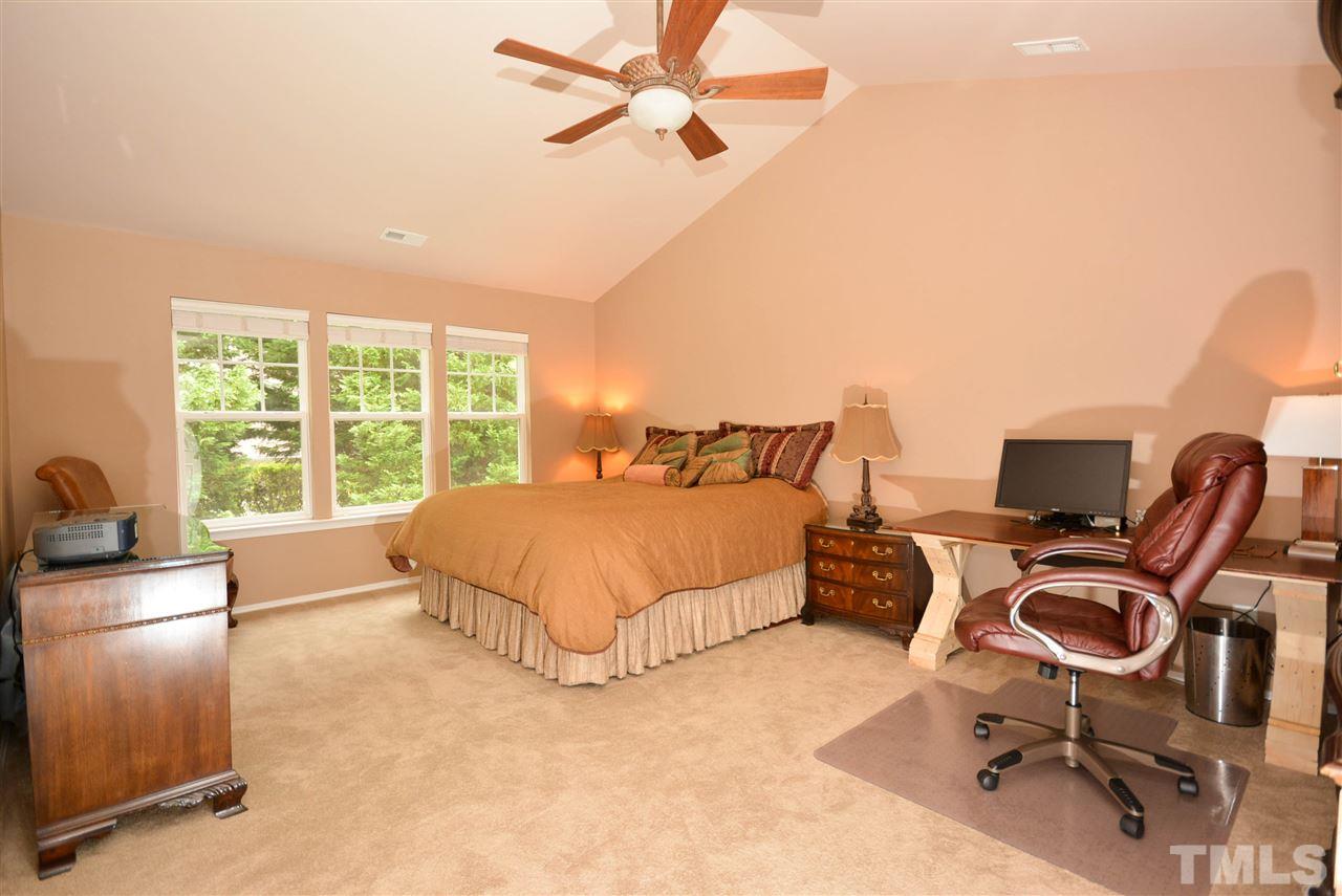 8502 Pillar Gate Lane Raleigh, NC 27613 - Photo 12 of 22 a bedroom with a bed workspace and a window