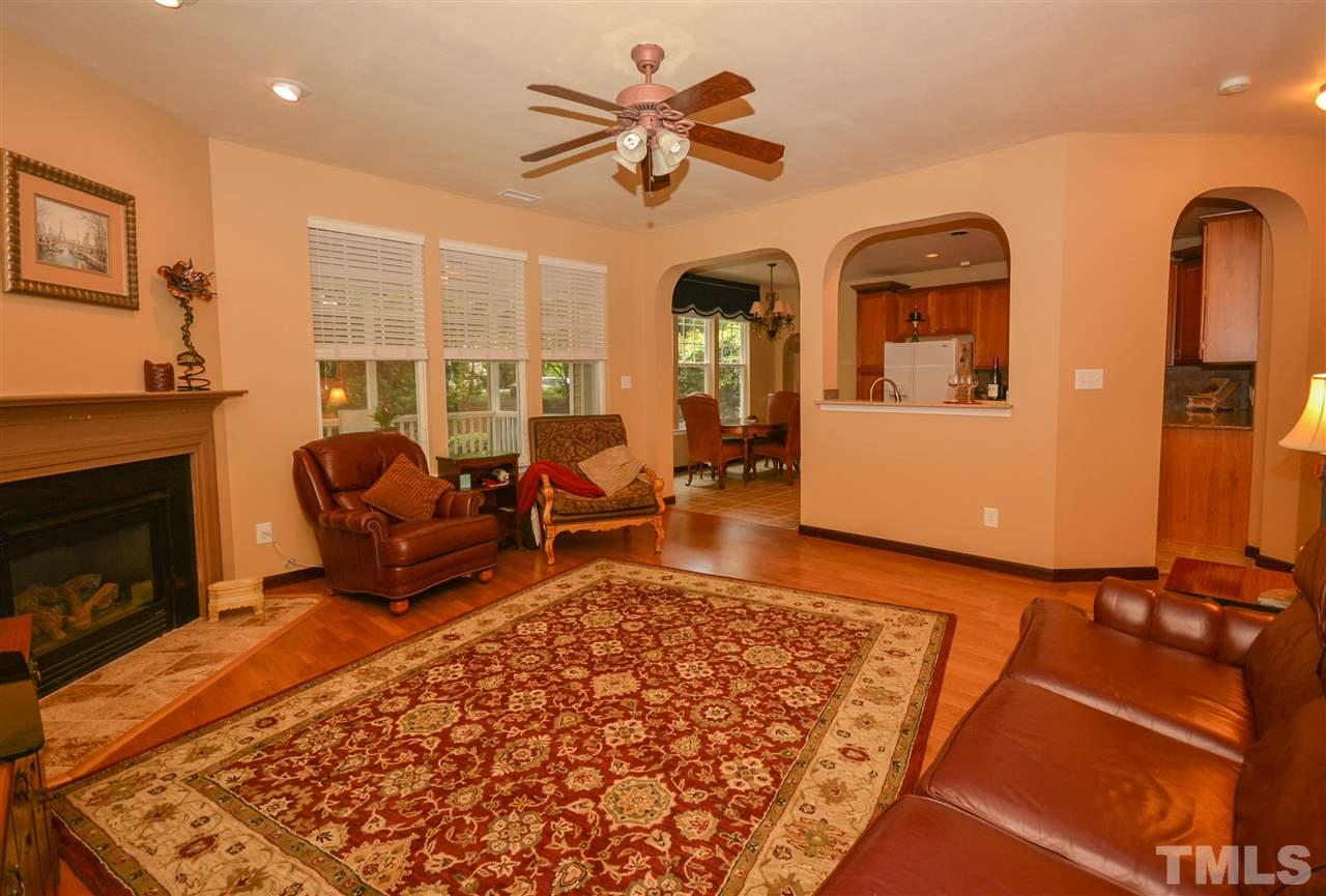 8502 Pillar Gate Lane Raleigh, NC 27613 - Photo 3 of 22 a living room with furniture rug and a fireplace