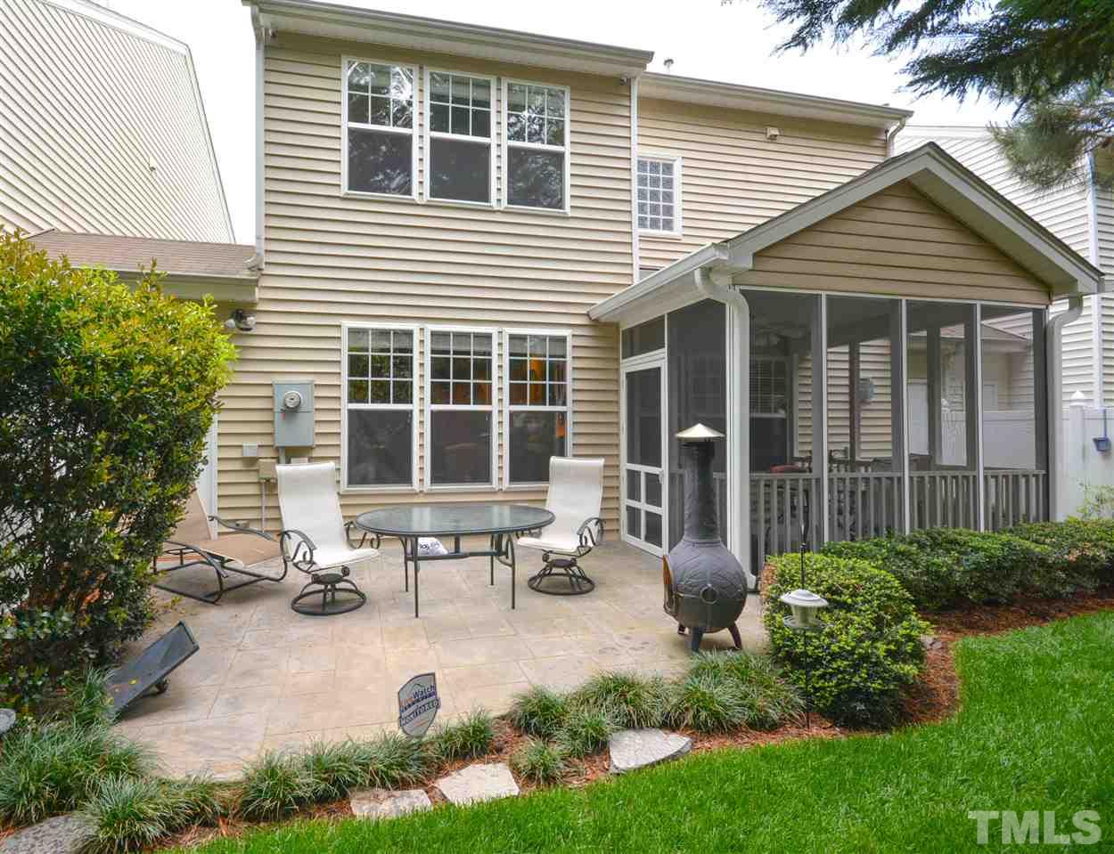 8502 Pillar Gate Lane Raleigh, NC 27613 - Photo 22 of 22 a view of a house with sitting area and garden