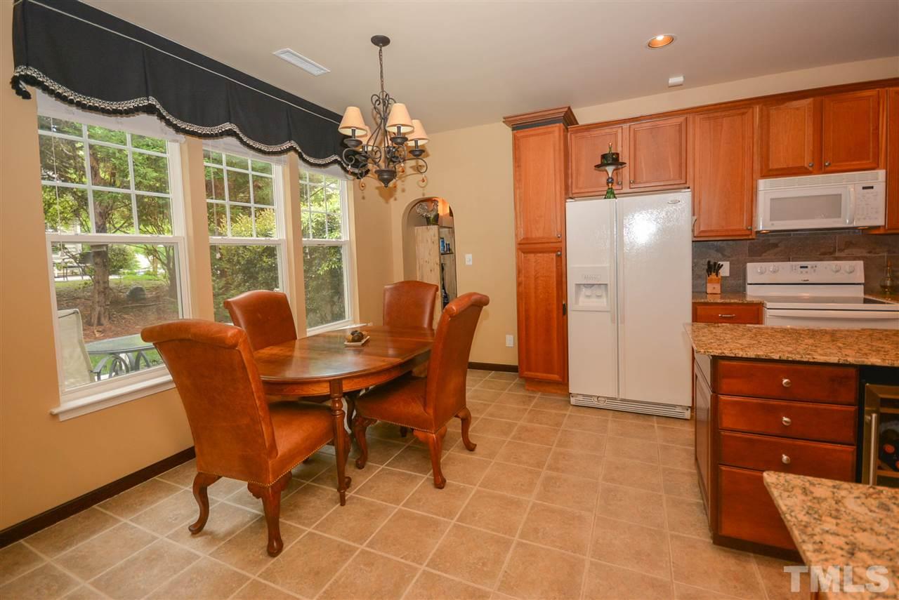 8502 Pillar Gate Lane Raleigh, NC 27613 - Photo 4 of 22 a view of a dining room with furniture window and outside view