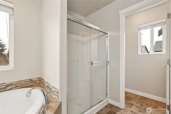 a white toilet sitting next to a bathroom sink