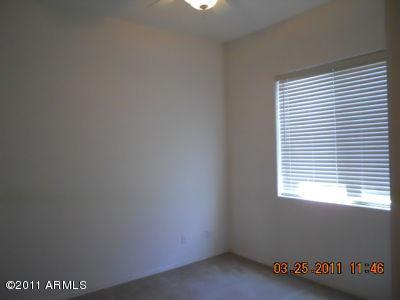 2018 North Pacey Road Phoenix, AZ 85037 - Photo 14 of 35 a view of an empty room with a window
