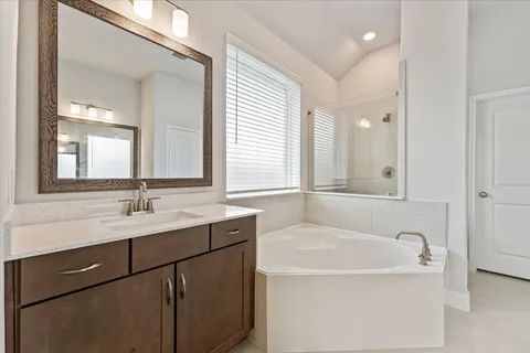 a bathroom with a bathtub and a sink