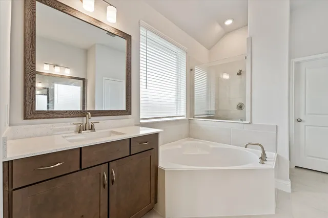 a bathroom with a bathtub and a sink