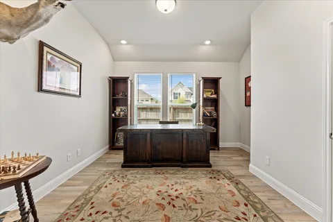 a bedroom with furniture and a window