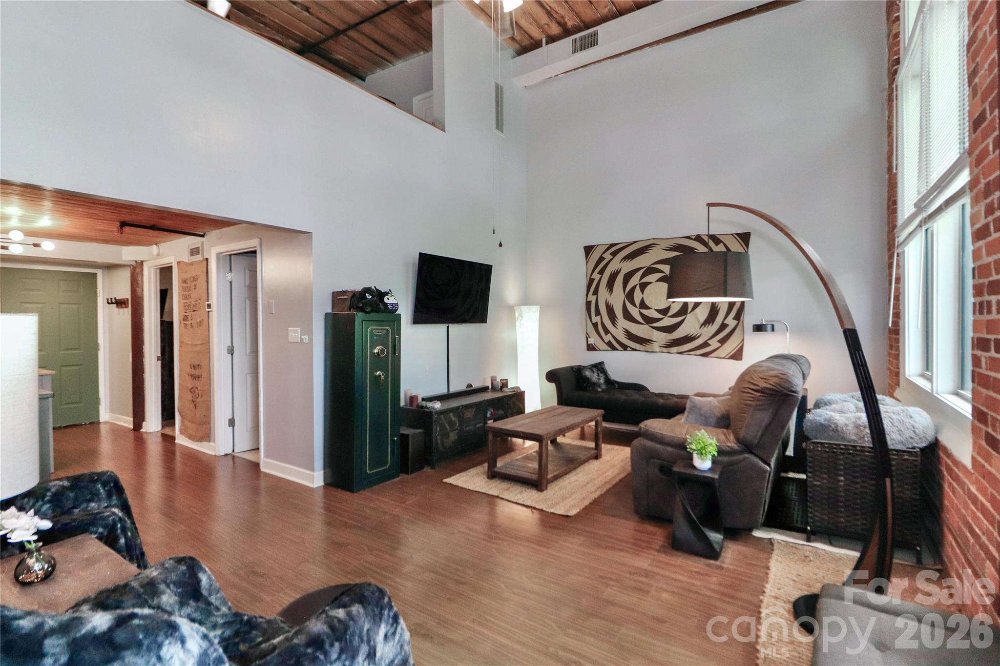 201 South Hoskins Road, Unit 315 Charlotte, NC 28208 - Photo 12 of 45 a reading room with furniture or couch and a flat screen tv