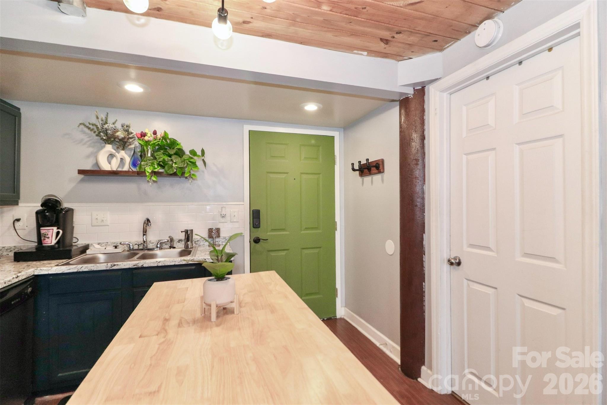 201 South Hoskins Road, Unit 315 Charlotte, NC 28208 - Photo 17 of 45 a bathroom with a sink a mirror and a shower