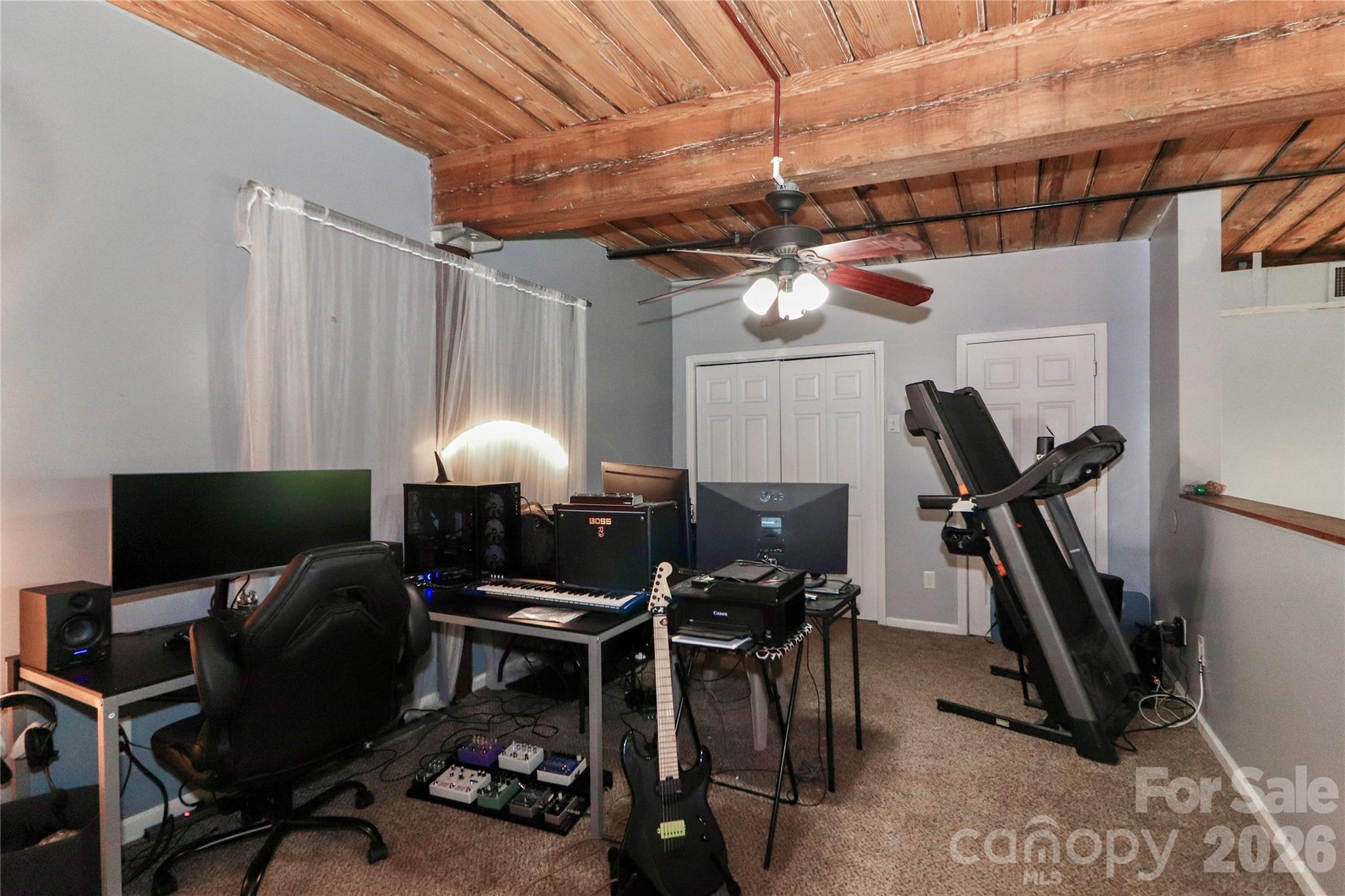 201 South Hoskins Road, Unit 315 Charlotte, NC 28208 - Photo 24 of 40 a workspace with furniture and a fan