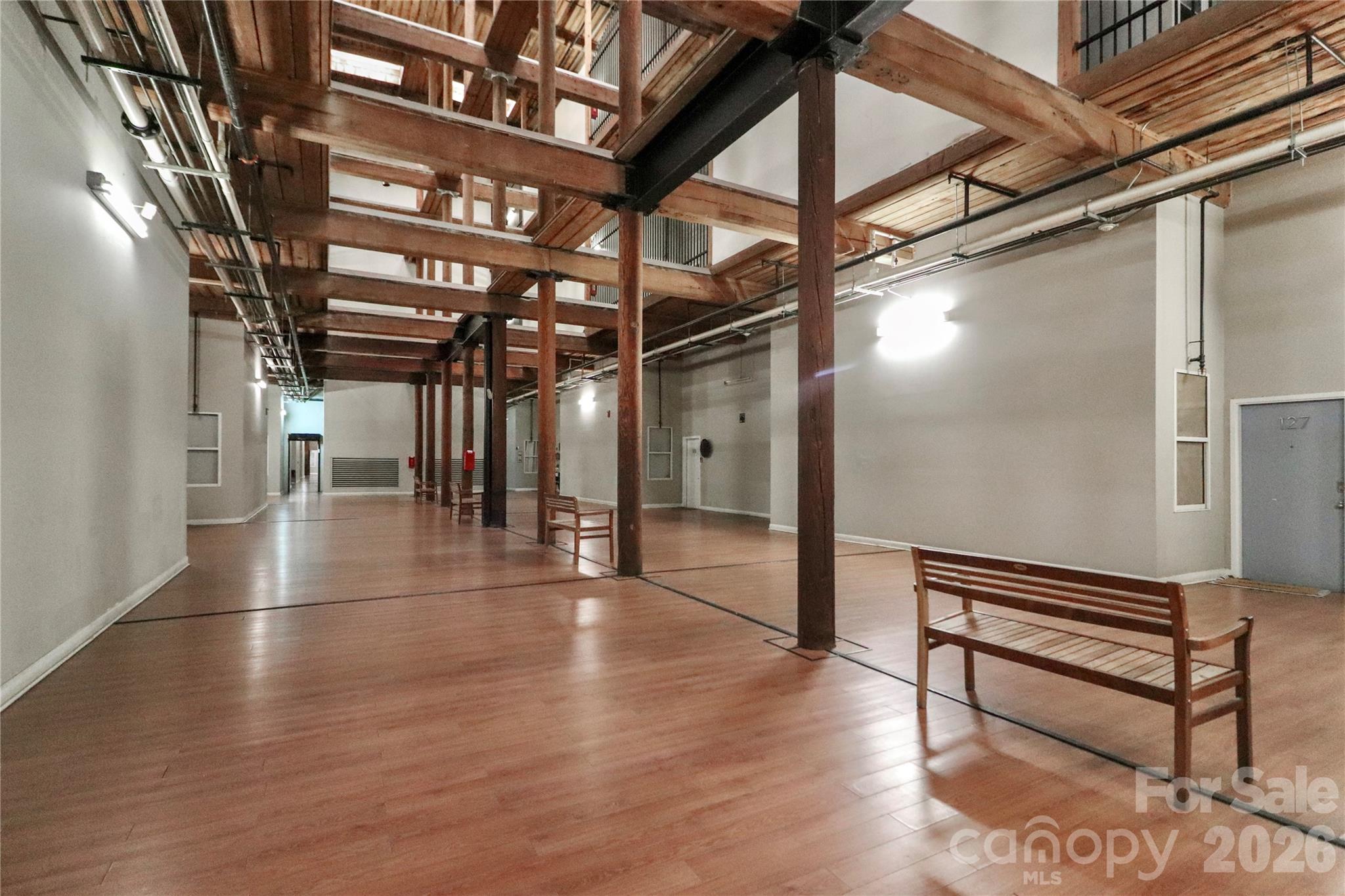 201 South Hoskins Road, Unit 315 Charlotte, NC 28208 - Photo 29 of 40 a view of empty room with wooden floor
