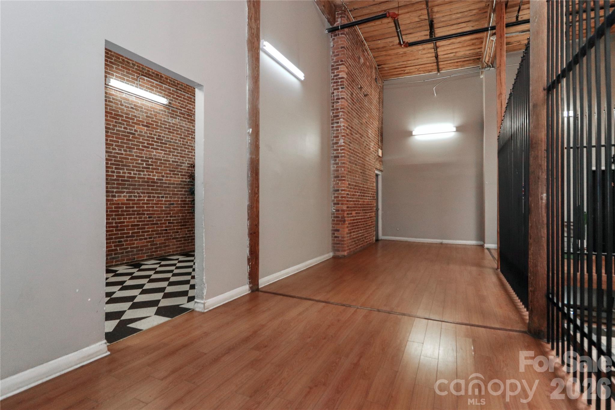 201 South Hoskins Road, Unit 315 Charlotte, NC 28208 - Photo 35 of 40 an empty room with wooden floor