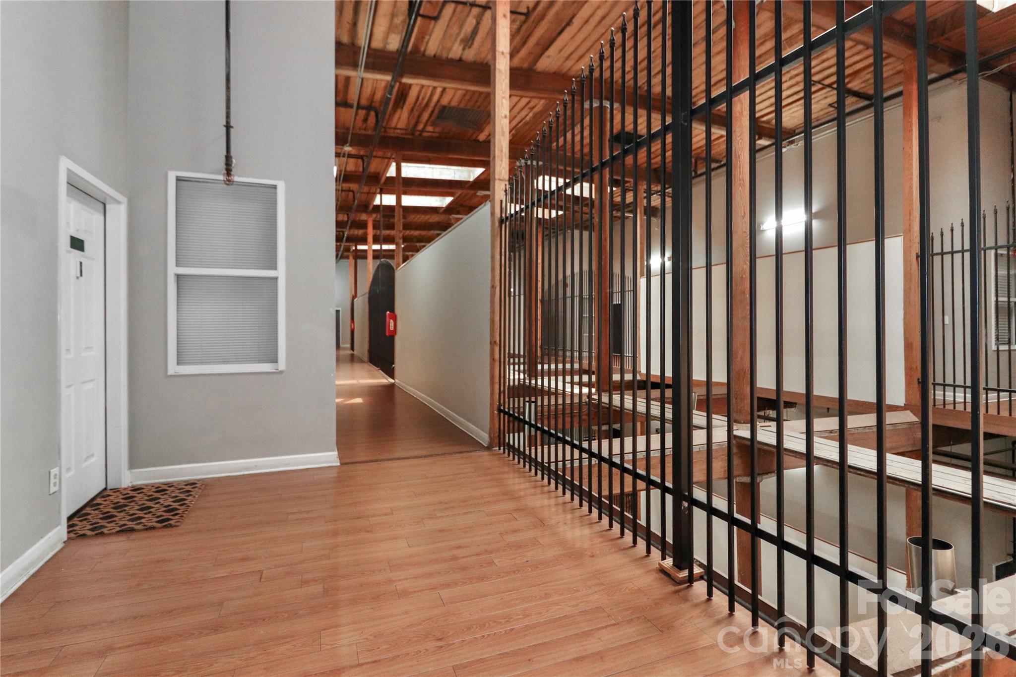 201 South Hoskins Road, Unit 315 Charlotte, NC 28208 - Photo 38 of 45 a view of entryway and hall with wooden floor