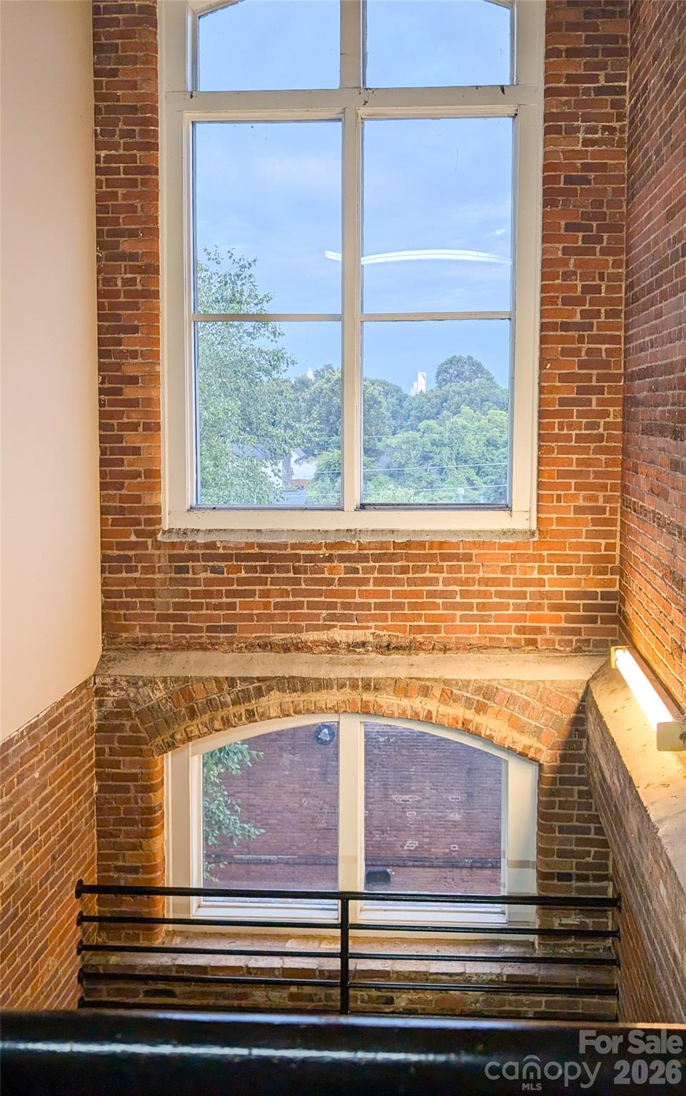 201 South Hoskins Road, Unit 315 Charlotte, NC 28208 - Photo 40 of 40 a view of a brick house with windows