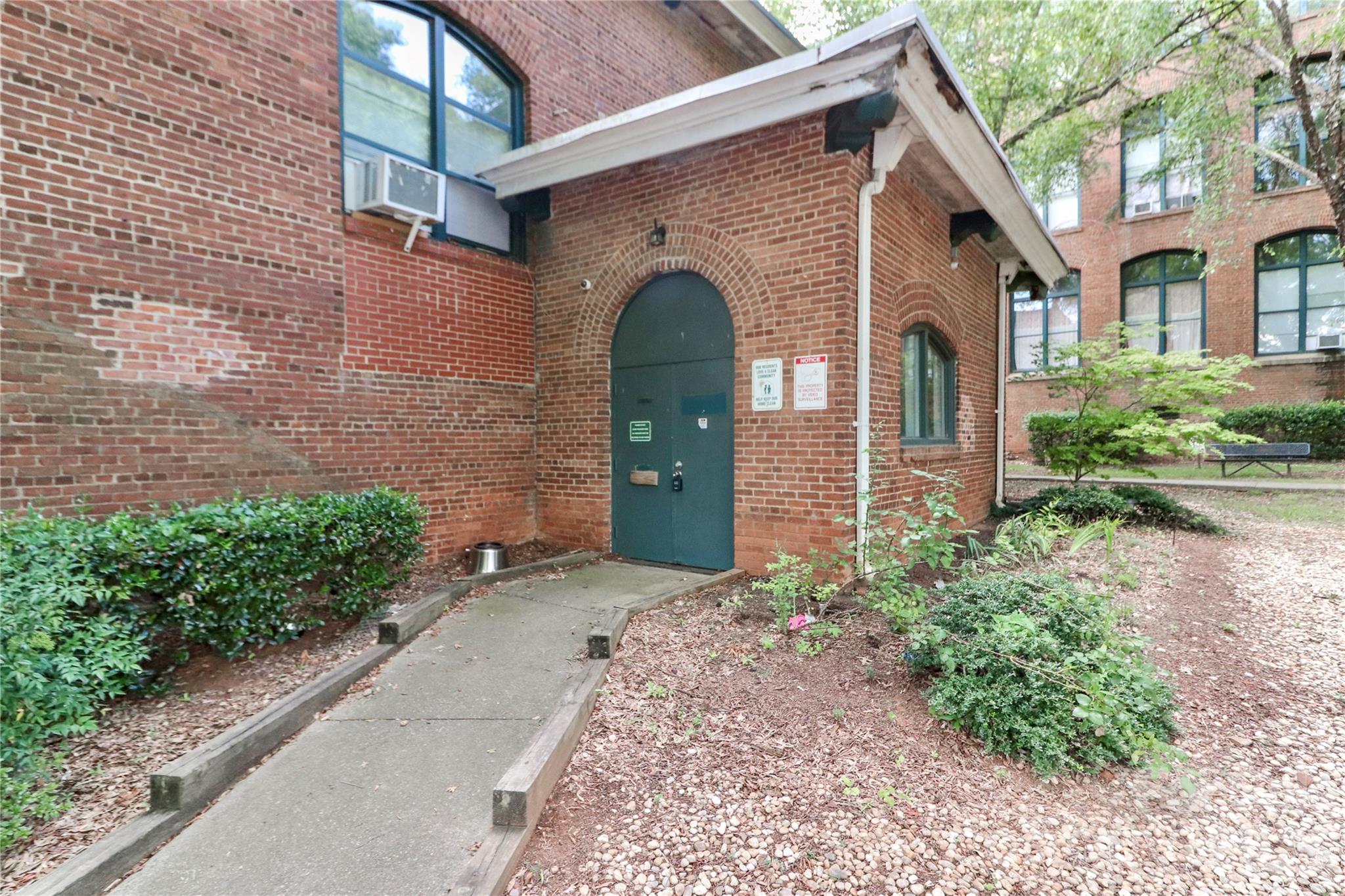 201 South Hoskins Road, Unit 315 Charlotte, NC 28208 - Photo 41 of 45 a front view of a house with a garden