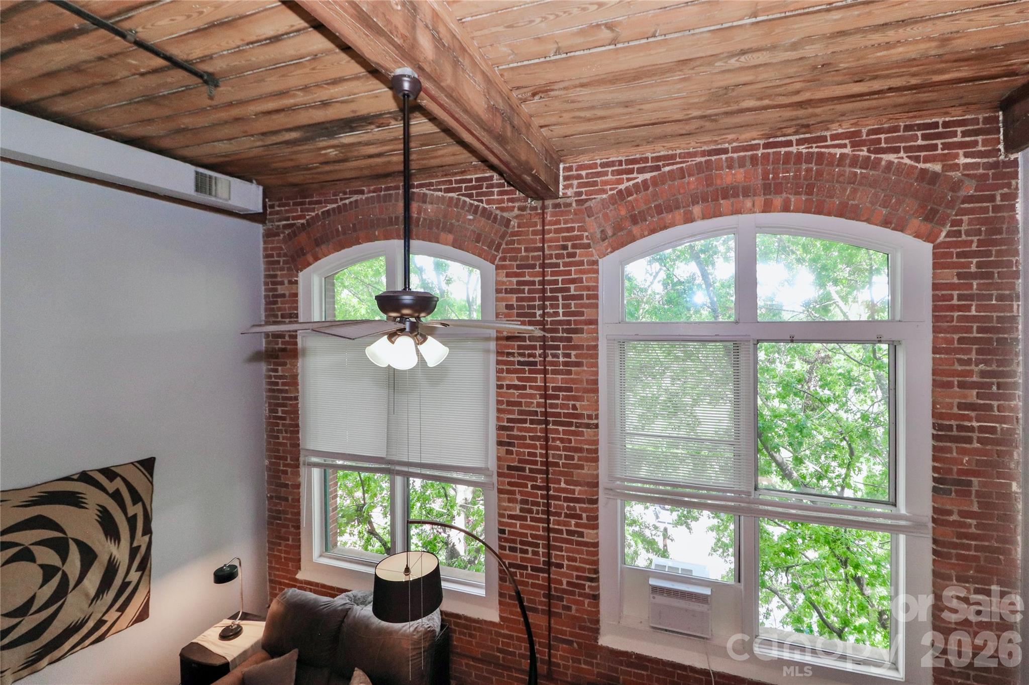 201 South Hoskins Road, Unit 315 Charlotte, NC 28208 - Photo 5 of 40 a room with furniture and a large window