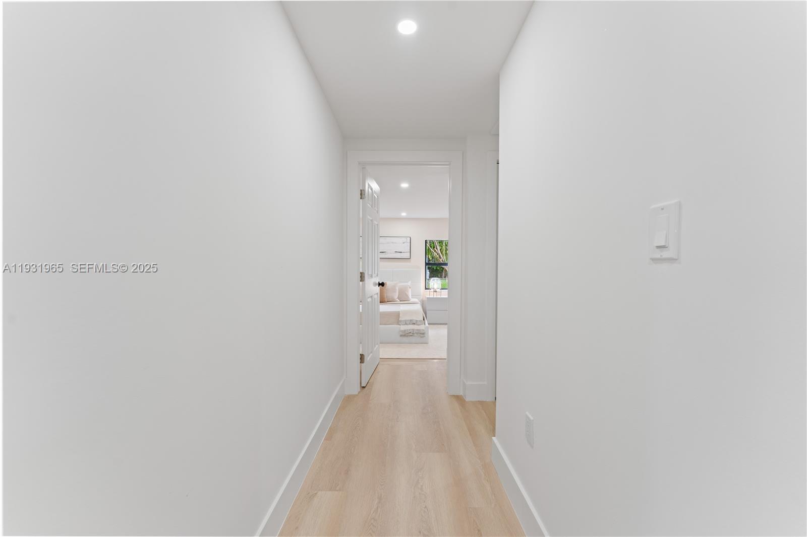 4555 Southwest 2nd Street Miami, FL 33134 - Photo 14 of 37 a view of a hallway with wooden floor and a bathroom