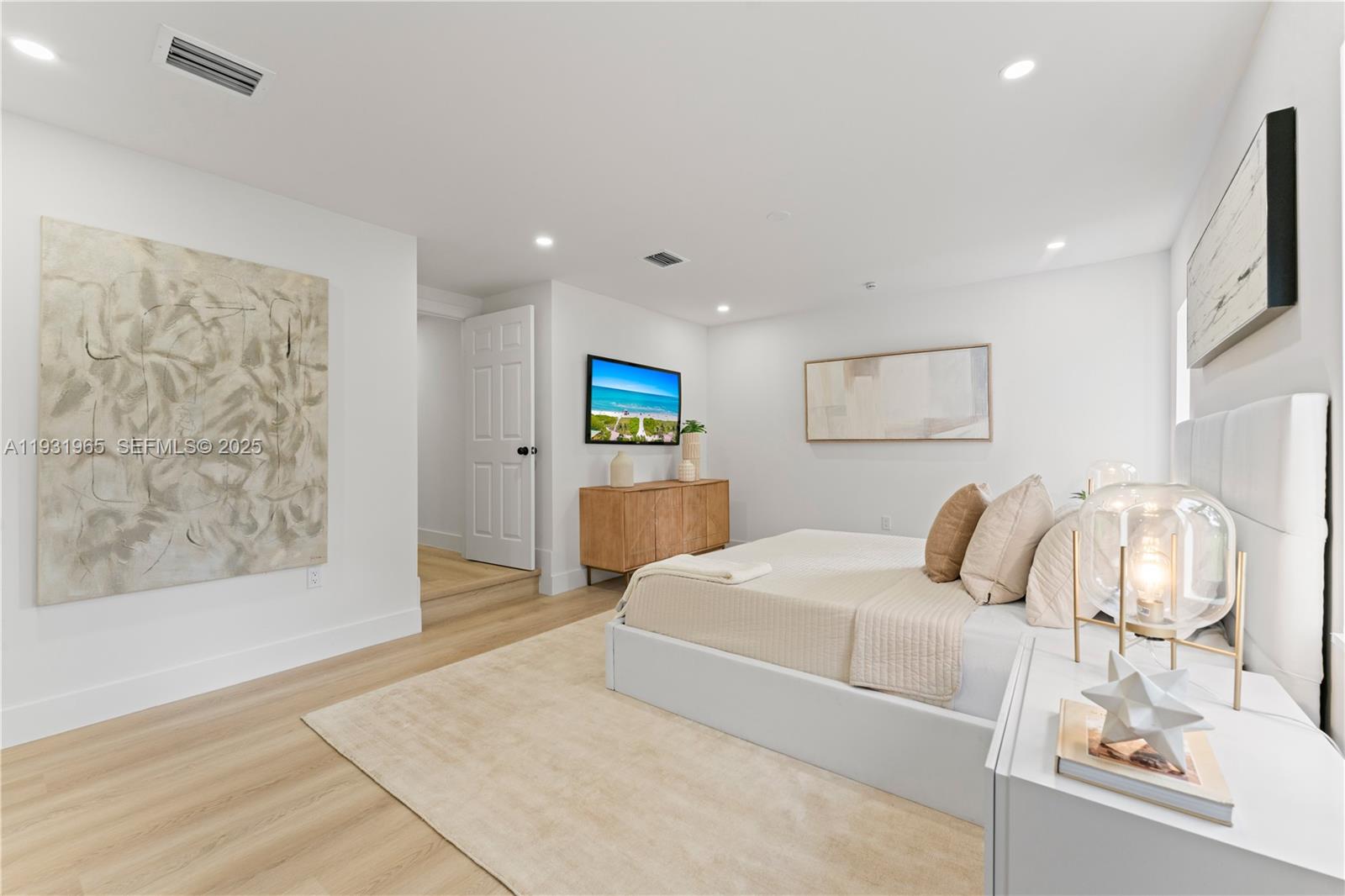 4555 Southwest 2nd Street Miami, FL 33134 - Photo 18 of 37 a bedroom with a bed and a painting on the wall