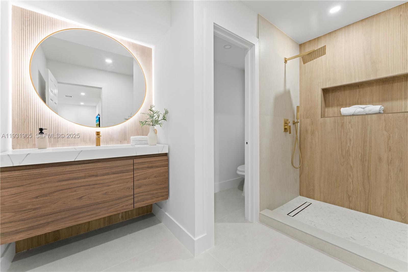 4555 Southwest 2nd Street Miami, FL 33134 - Photo 20 of 37 a bathroom with a double vanity sink and mirror