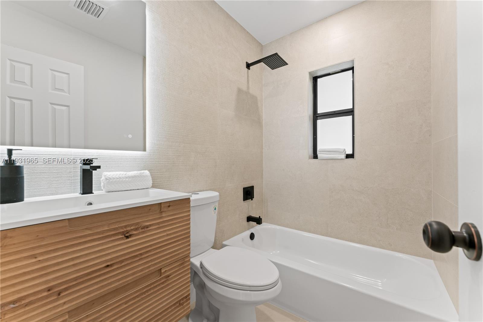 4555 Southwest 2nd Street Miami, FL 33134 - Photo 23 of 37 a bathroom with a sink a toilet and shower