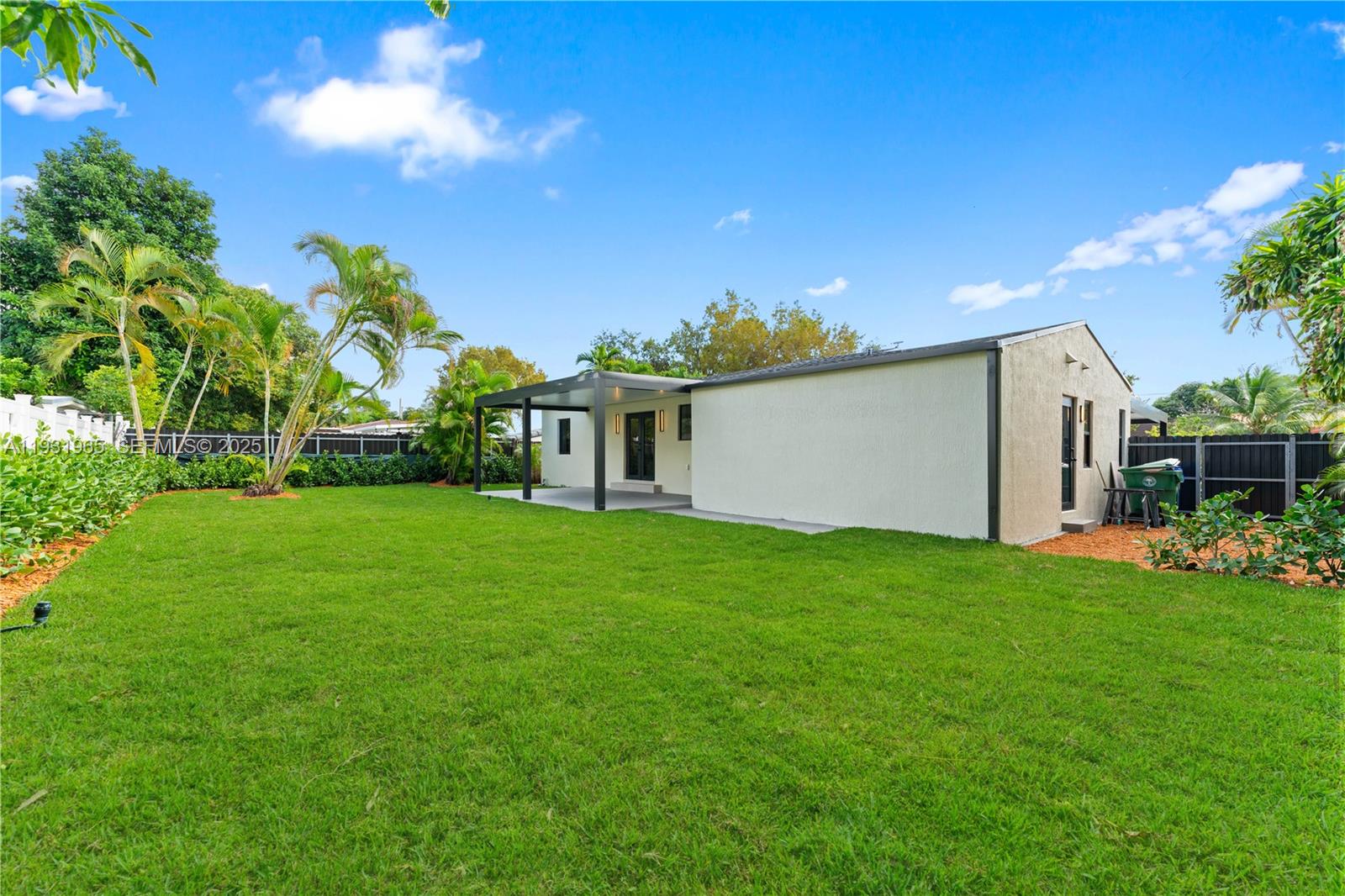 4555 Southwest 2nd Street Miami, FL 33134 - Photo 31 of 37 a view of a house with backyard and garden