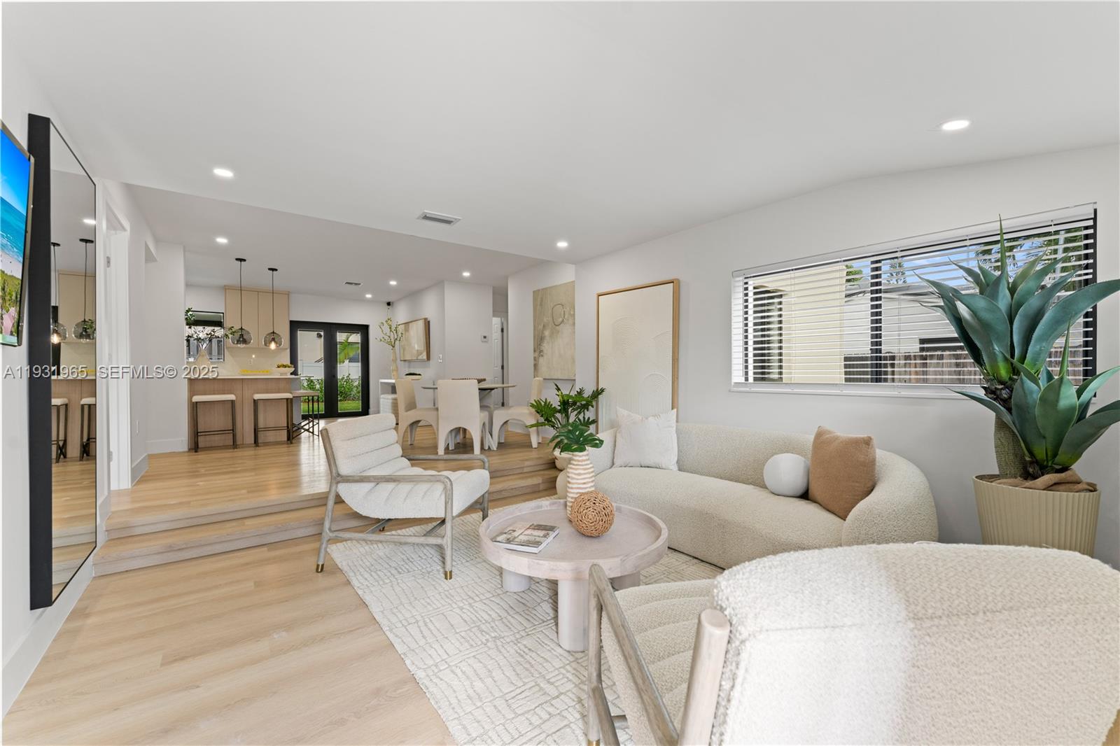 4555 Southwest 2nd Street Miami, FL 33134 - Photo 5 of 37 a living room with furniture kitchen view and a potted plant