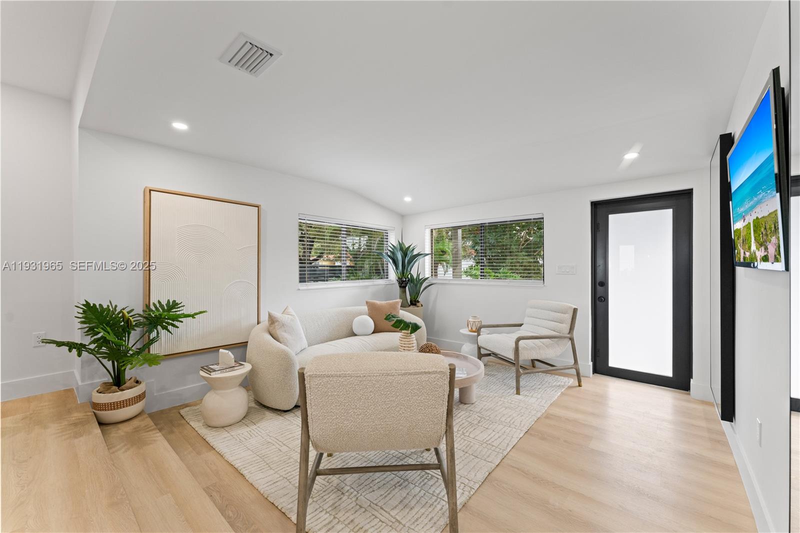 4555 Southwest 2nd Street Miami, FL 33134 - Photo 6 of 37 a living room with furniture potted plant and a window