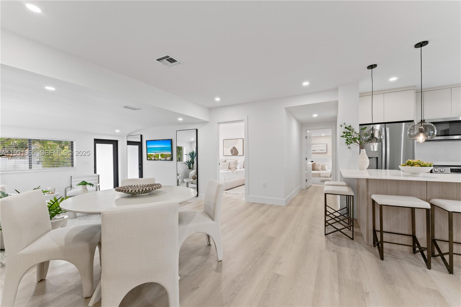 4555 Southwest 2nd Street Miami, FL 33134 - Photo 8 of 37 a living room with furniture a dining table and kitchen view