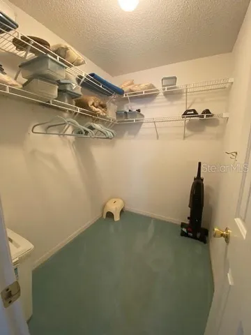 a view of a room with racks on the wall