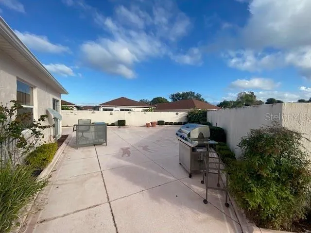 a terrace with outdoor seating and city view