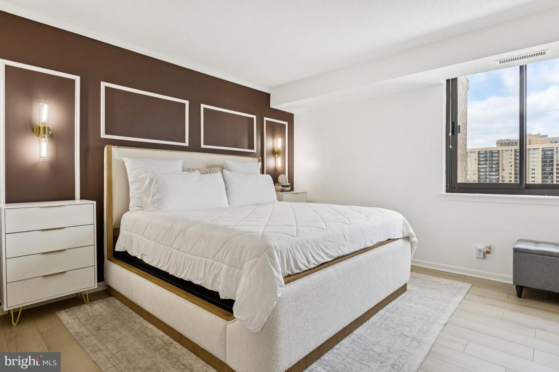 5505 Seminary Road, Unit 1810N Falls Church, VA 22041 - Photo 12 of 27 a large bed sitting in a bedroom next to a window