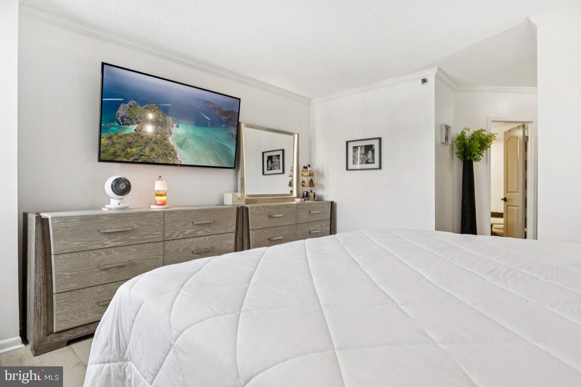 5505 Seminary Road, Unit 1810N Falls Church, VA 22041 - Photo 13 of 27 a bedroom with a bed and a flat screen tv