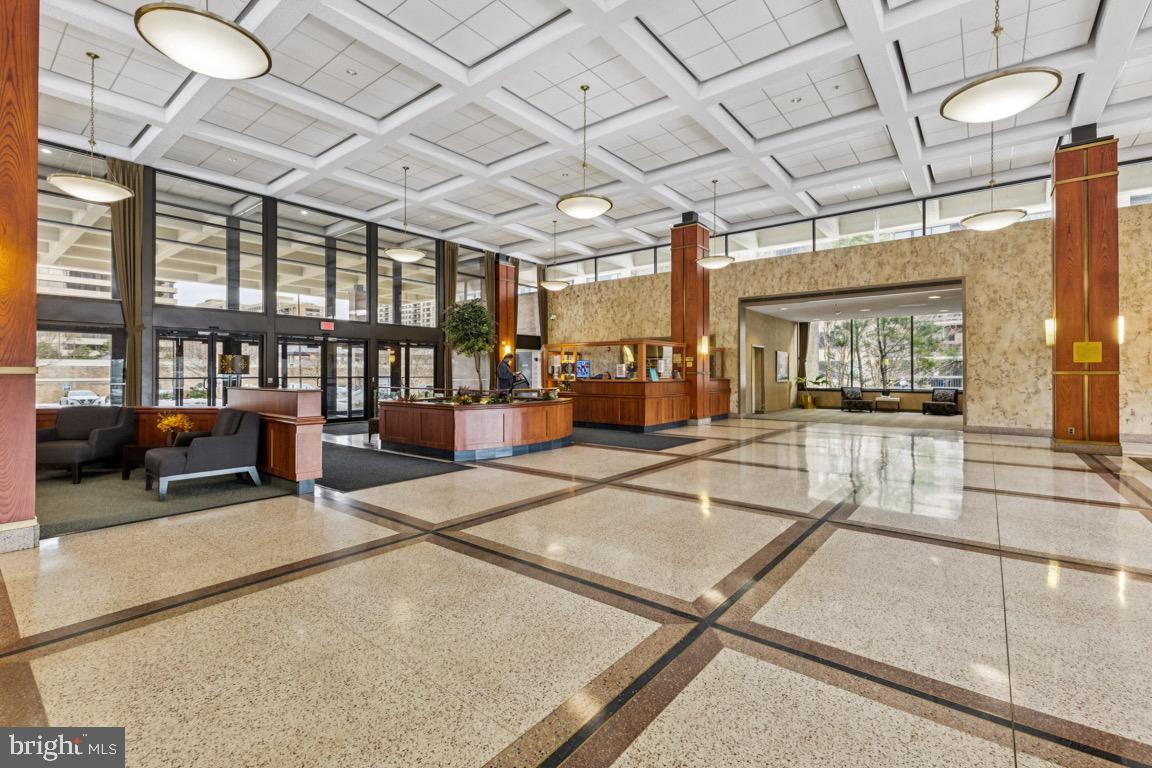5505 Seminary Road, Unit 1810N Falls Church, VA 22041 - Photo 17 of 27 a living room with lots of furniture and a chandelier