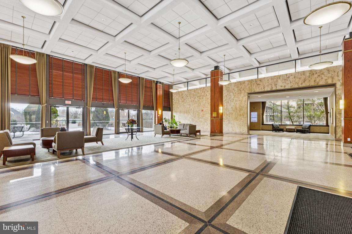 5505 Seminary Road, Unit 1810N Falls Church, VA 22041 - Photo 18 of 27 a lobby with furniture and large windows