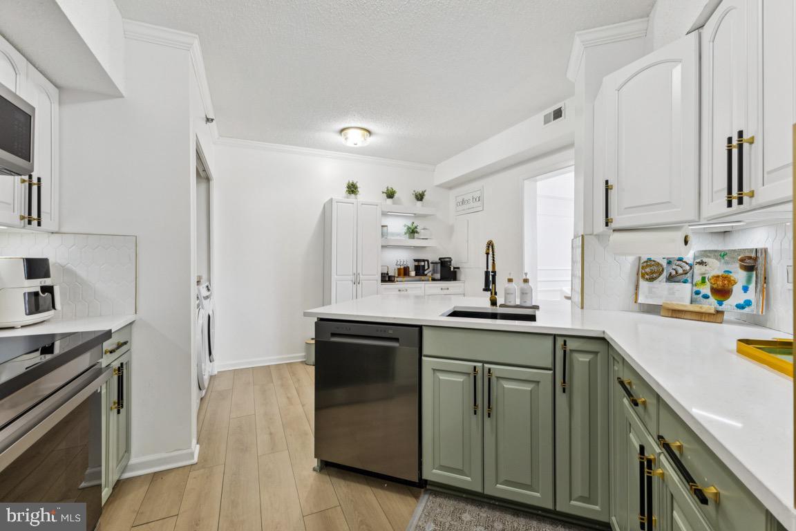 5505 Seminary Road, Unit 1810N Falls Church, VA 22041 - Photo 2 of 27 a kitchen with a sink cabinets and stainless steel appliances