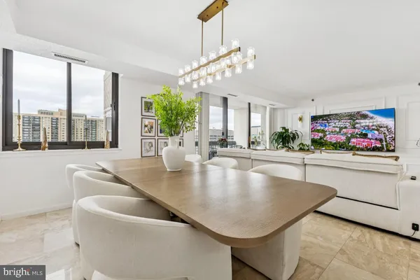 a very nice looking dining room with a large window