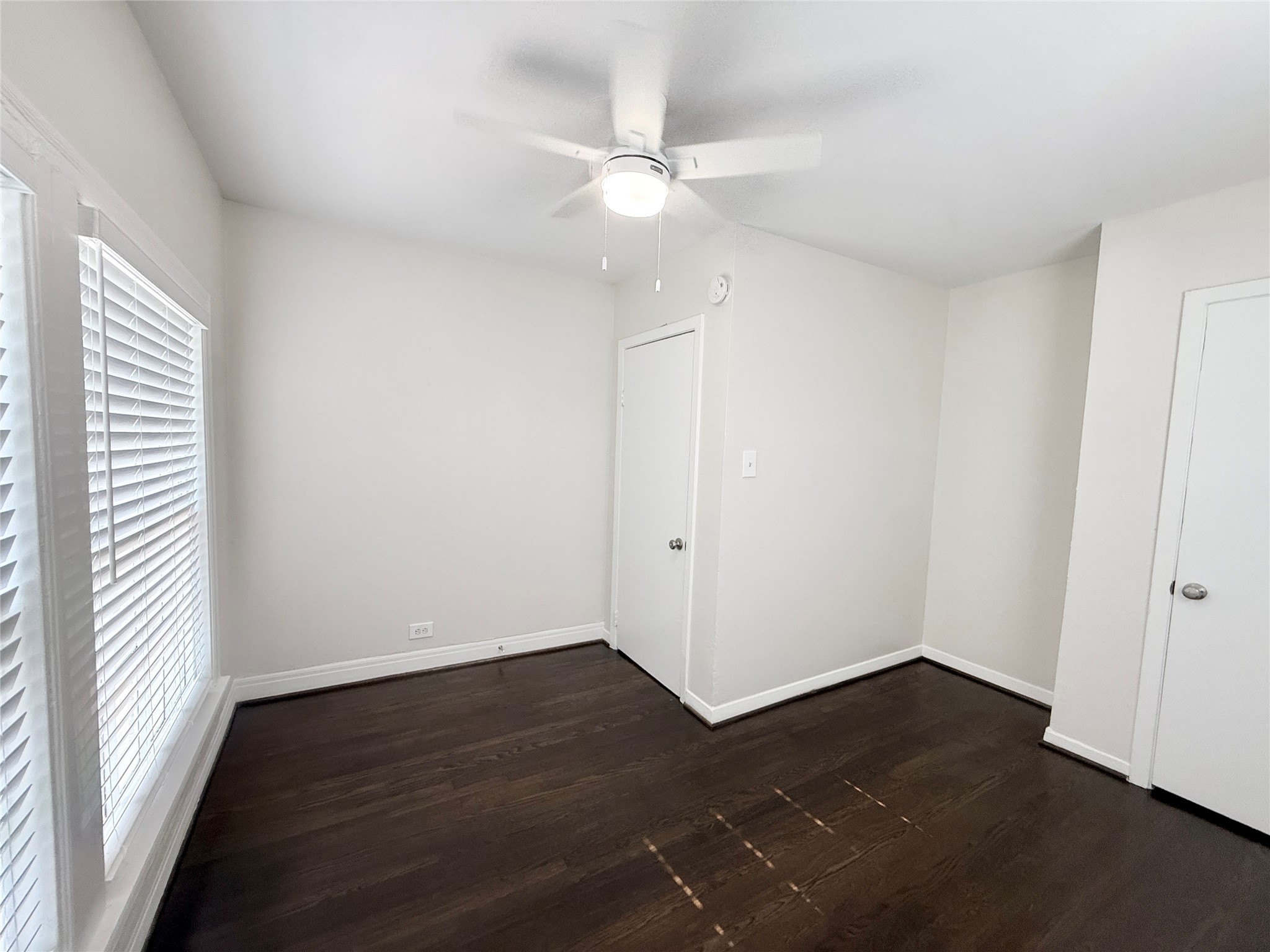 5402 Jackson Street, Unit 1 Houston, TX 77004 - Photo 17 of 18 wooden floor in an empty room with a window