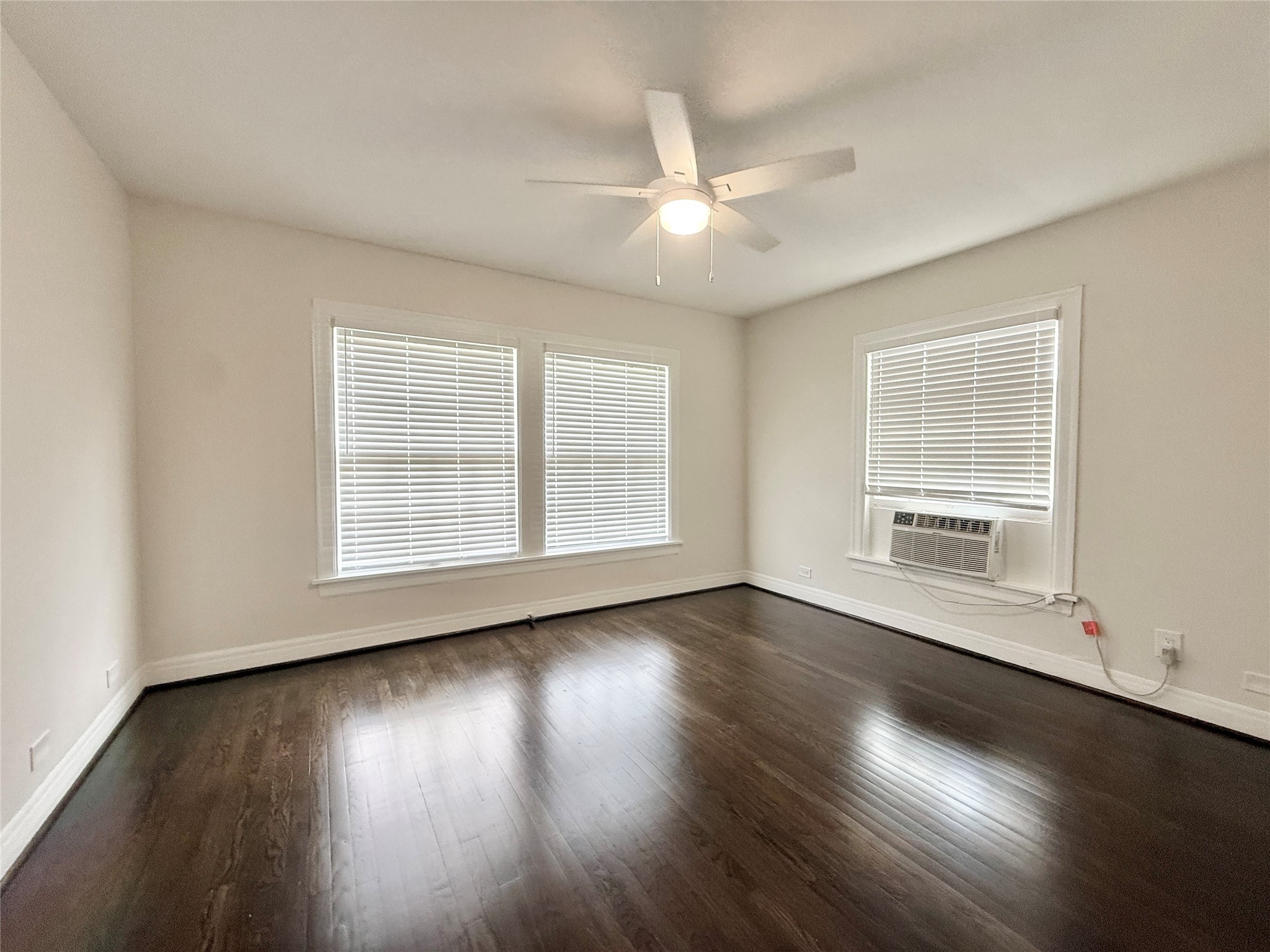 5402 Jackson Street, Unit 1 Houston, TX 77004 - Photo 10 of 18 a view of wooden floor and windows in a room