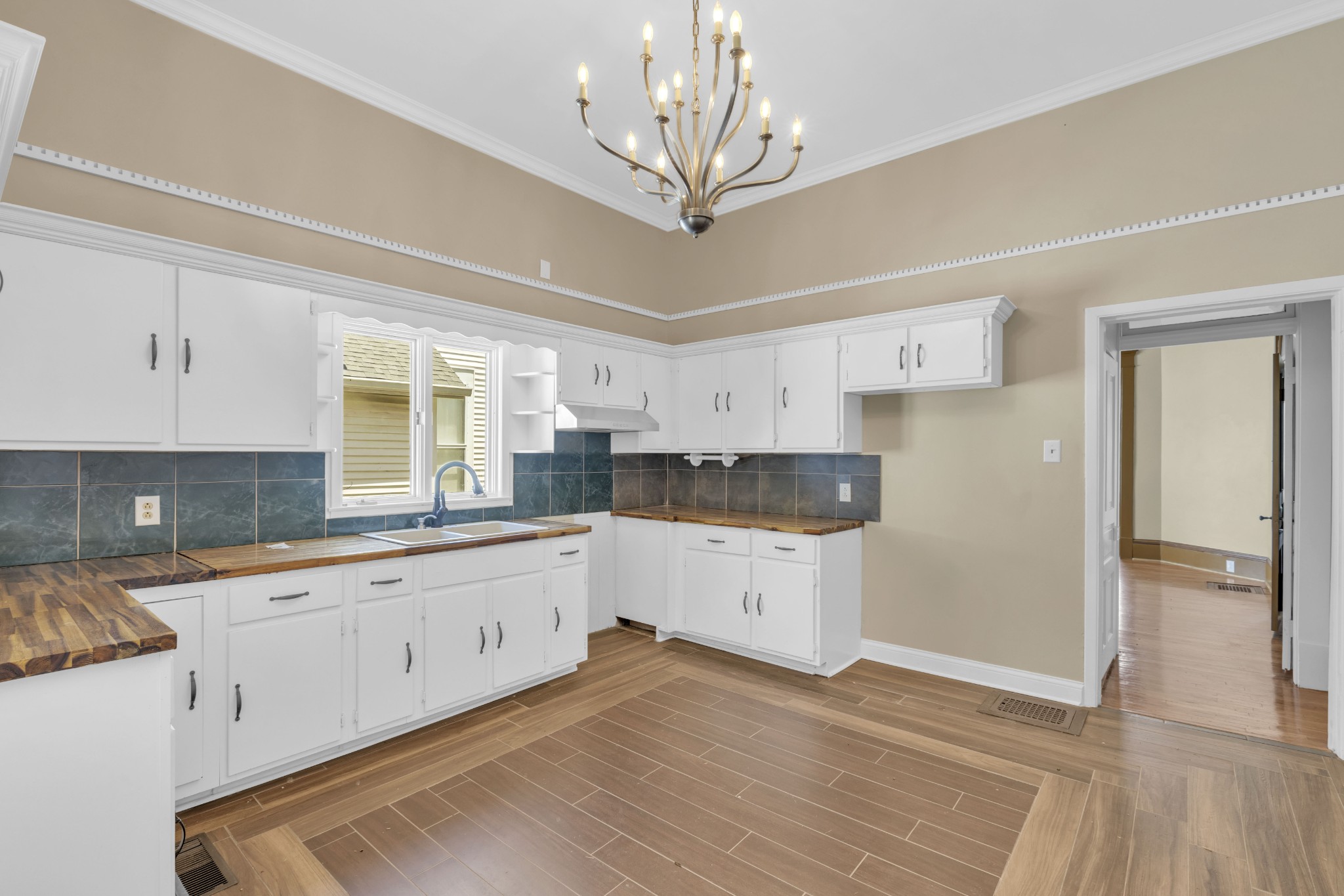 115 North Main Street Springfield, TN 37172 - Photo 20 of 24 a kitchen with granite countertop white cabinets and white appliances