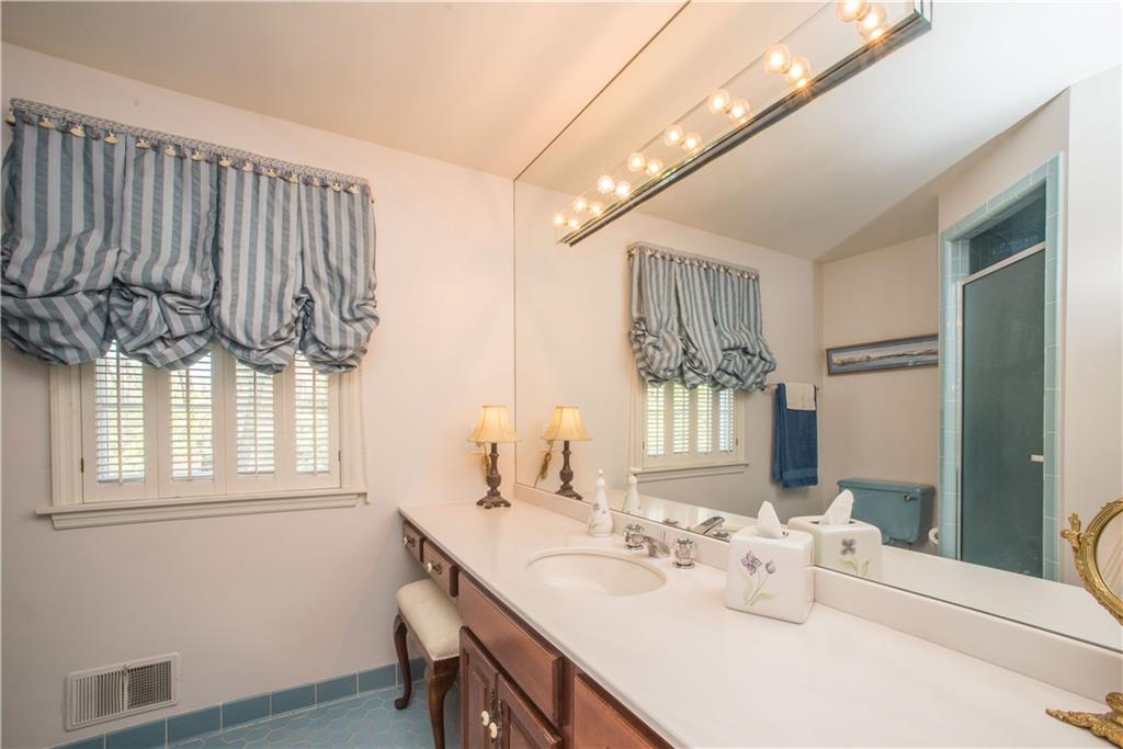 885 Old Hickory Road Mt. Lebanon, PA 15243 - Photo 14 of 25 The wide vanity in the master bath offers plentiful storage space. A tiled step-in shower and tile floor are other features of the master bath. This room was recently painted.