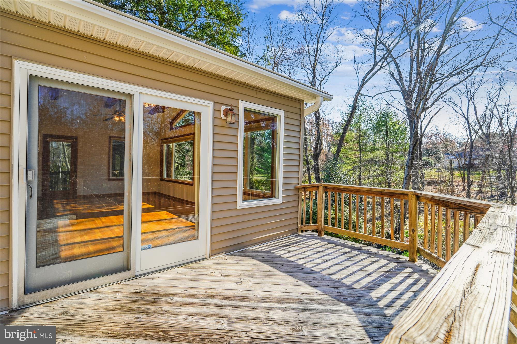 4048 Arjay Circle Ellicott City, MD 21042 - Photo 15 of 56 a view of a balcony with wooden floor and fence