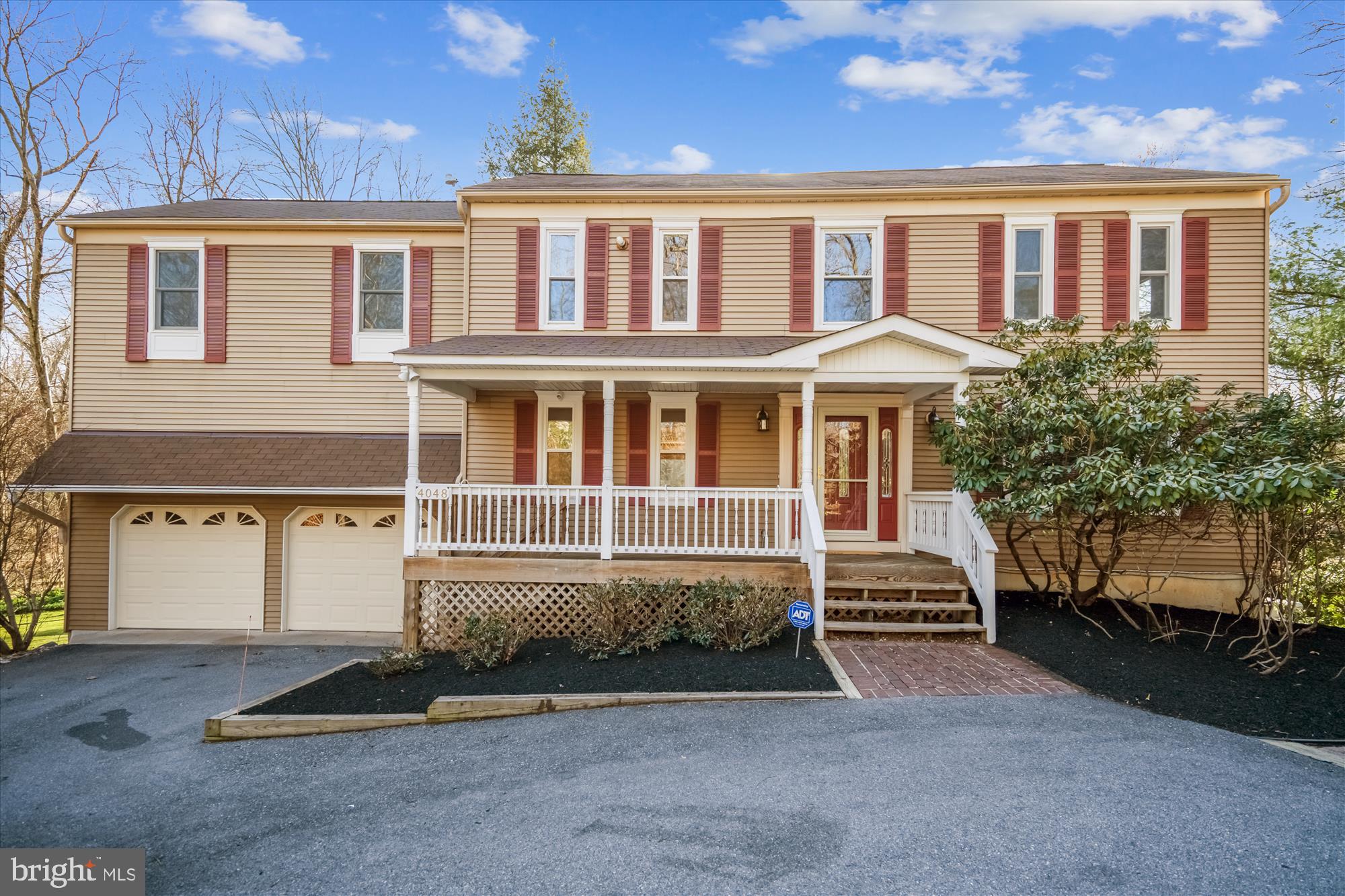 4048 Arjay Circle Ellicott City, MD 21042 - Photo 2 of 56 a front view of a house with a yard