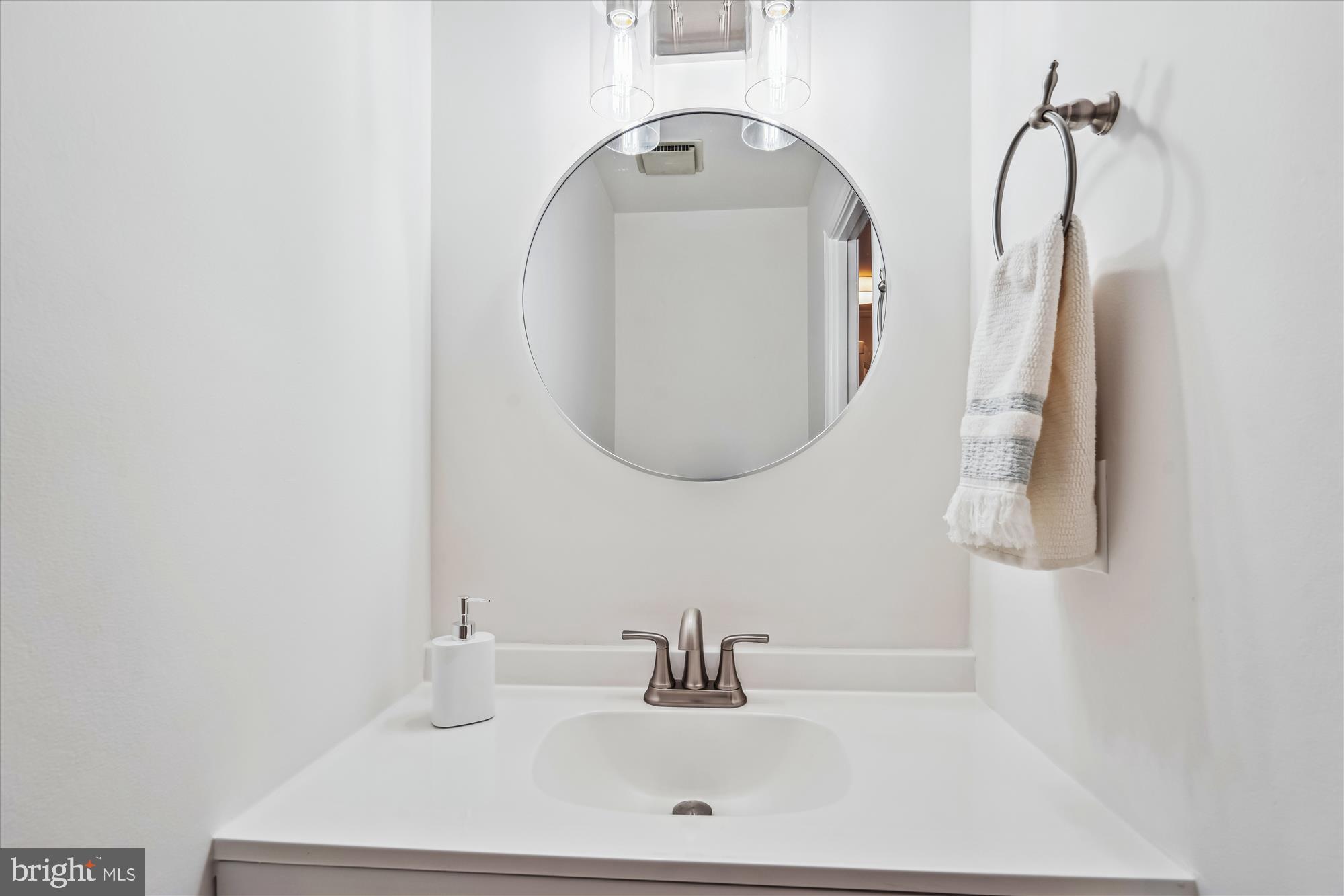 4048 Arjay Circle Ellicott City, MD 21042 - Photo 21 of 56 a bathroom with a sink and a mirror