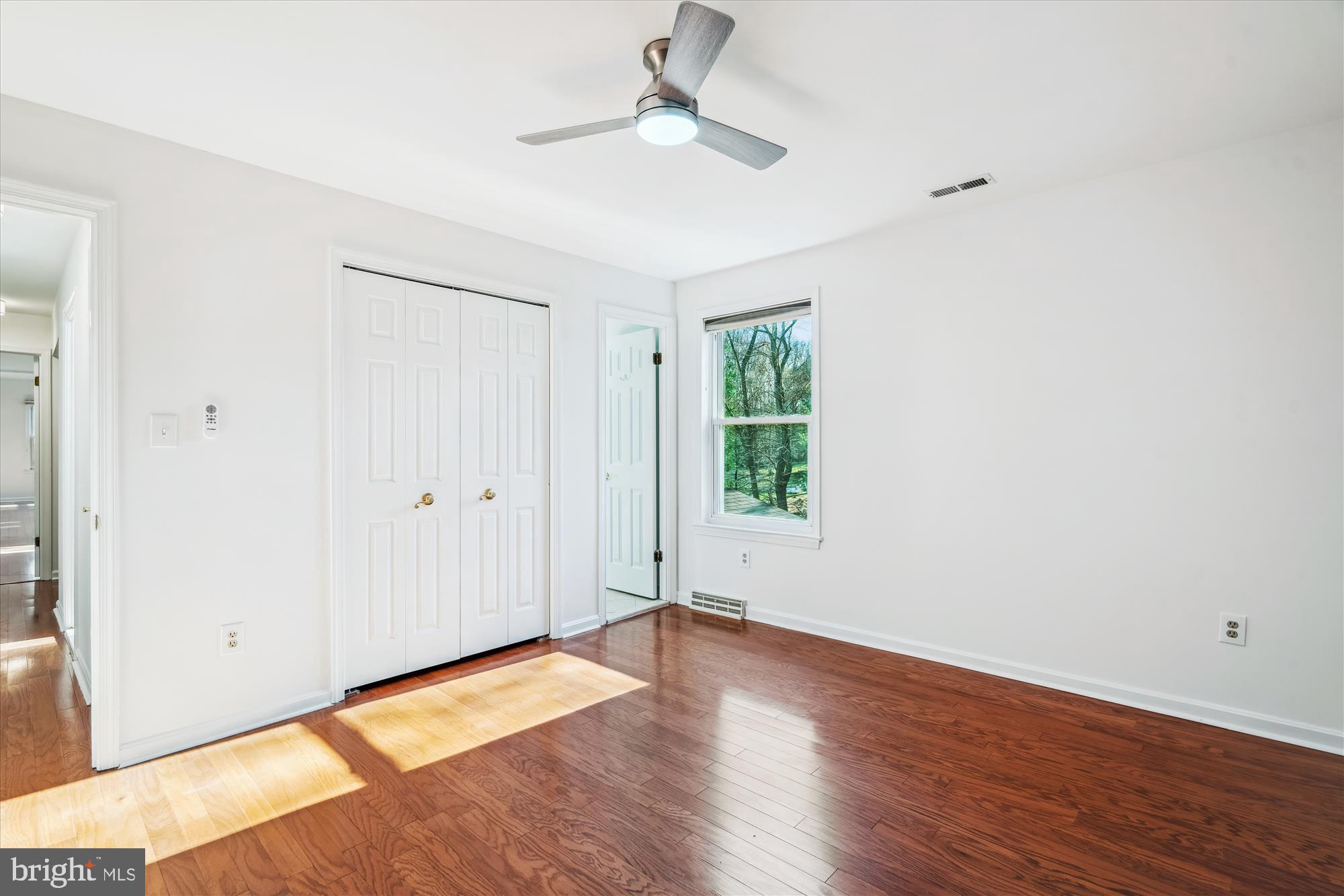4048 Arjay Circle Ellicott City, MD 21042 - Photo 26 of 56 a view of empty room with wooden floor and fan