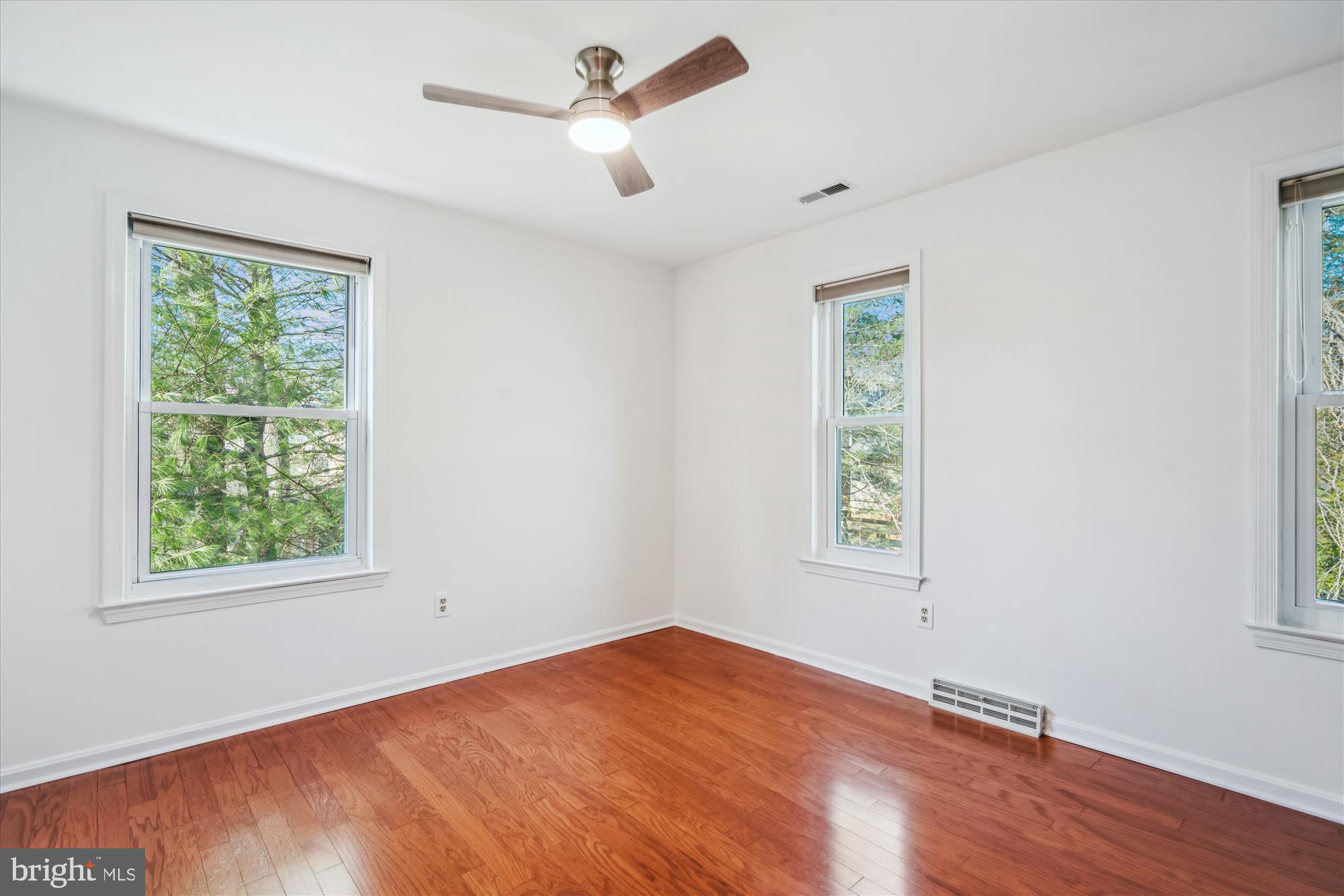 4048 Arjay Circle Ellicott City, MD 21042 - Photo 27 of 56 a view of an empty room with wooden floor and a window