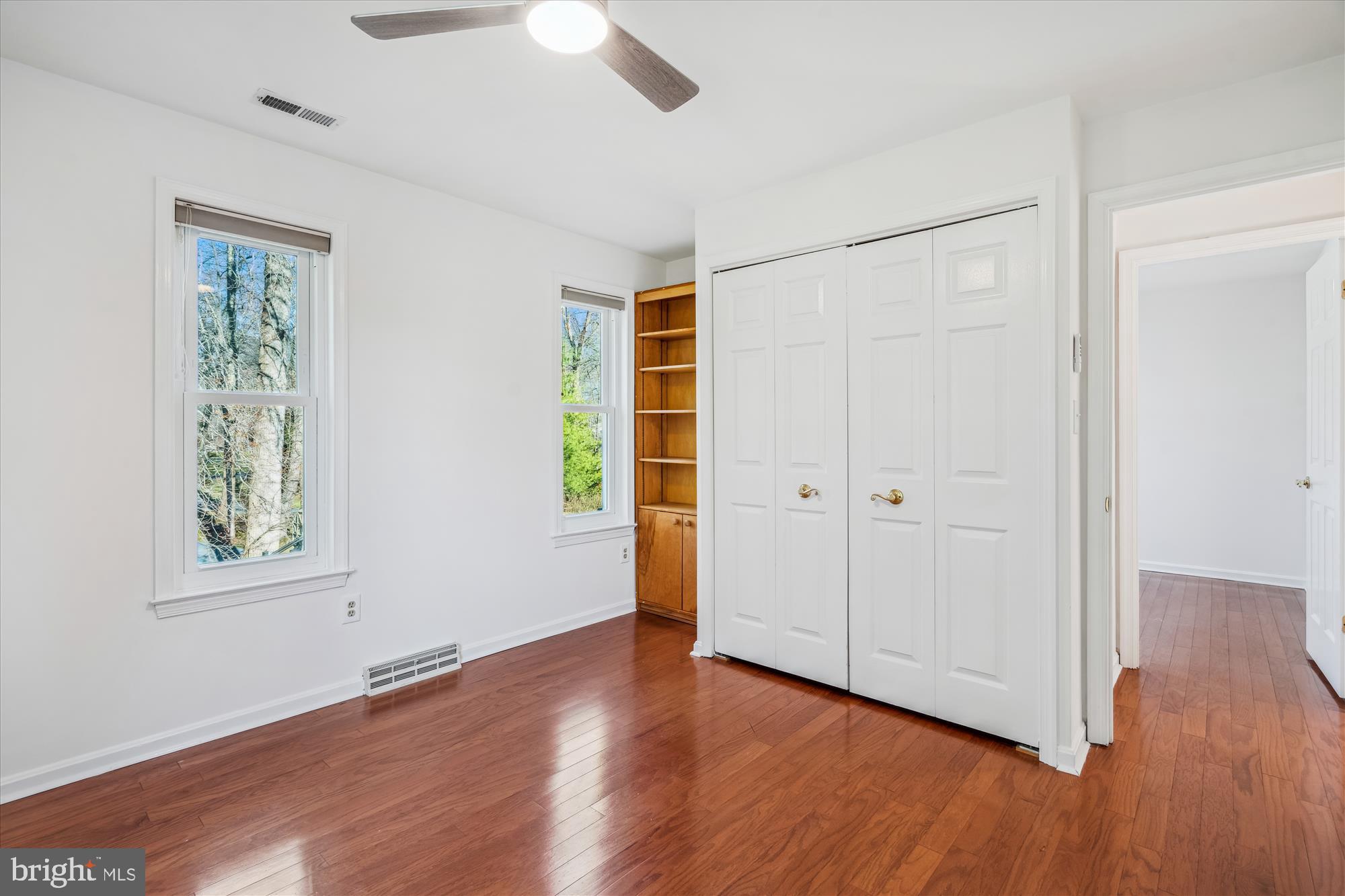 4048 Arjay Circle Ellicott City, MD 21042 - Photo 28 of 56 a view of an empty room with wooden floor and a window