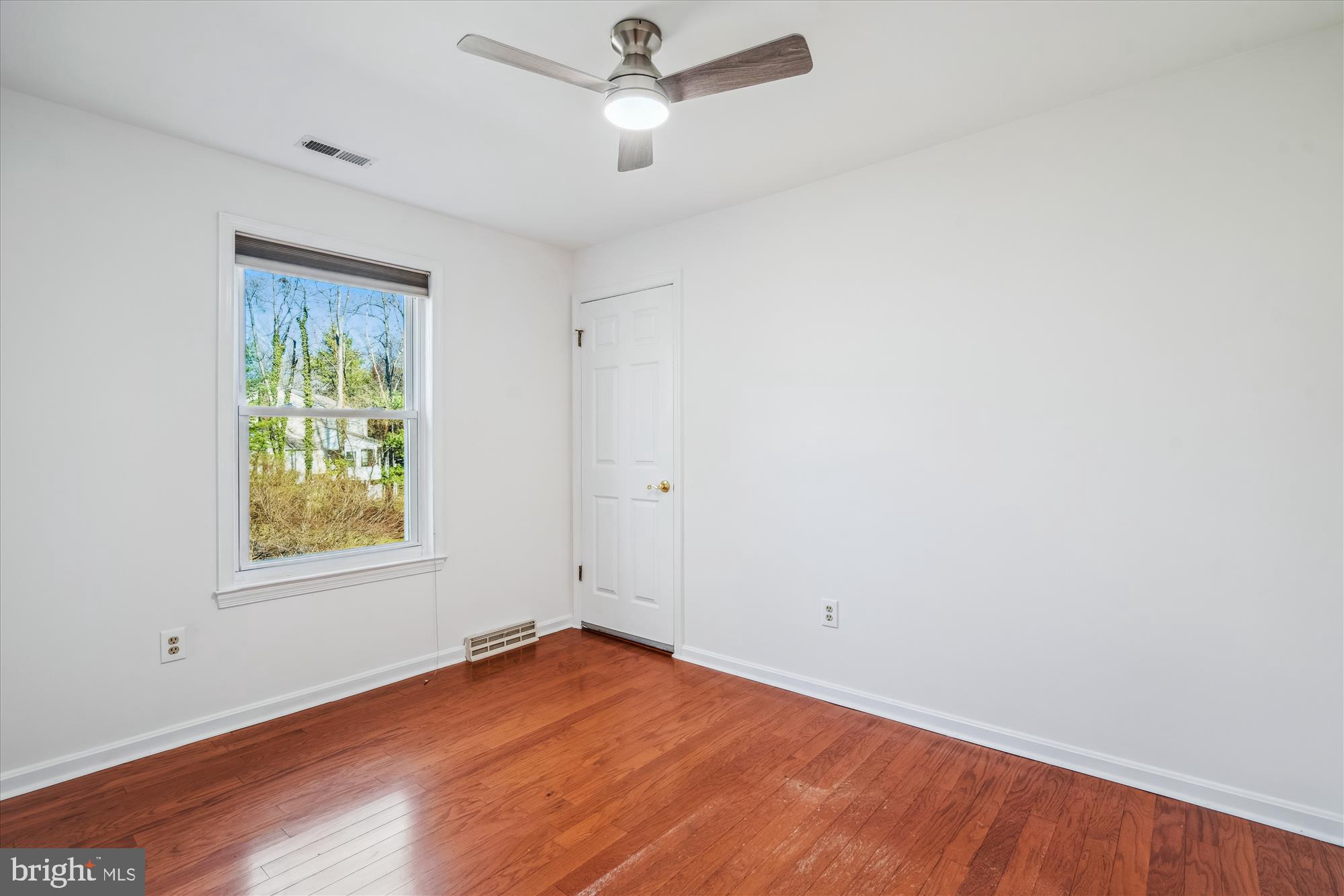 4048 Arjay Circle Ellicott City, MD 21042 - Photo 29 of 56 wooden floor in an empty room with a window