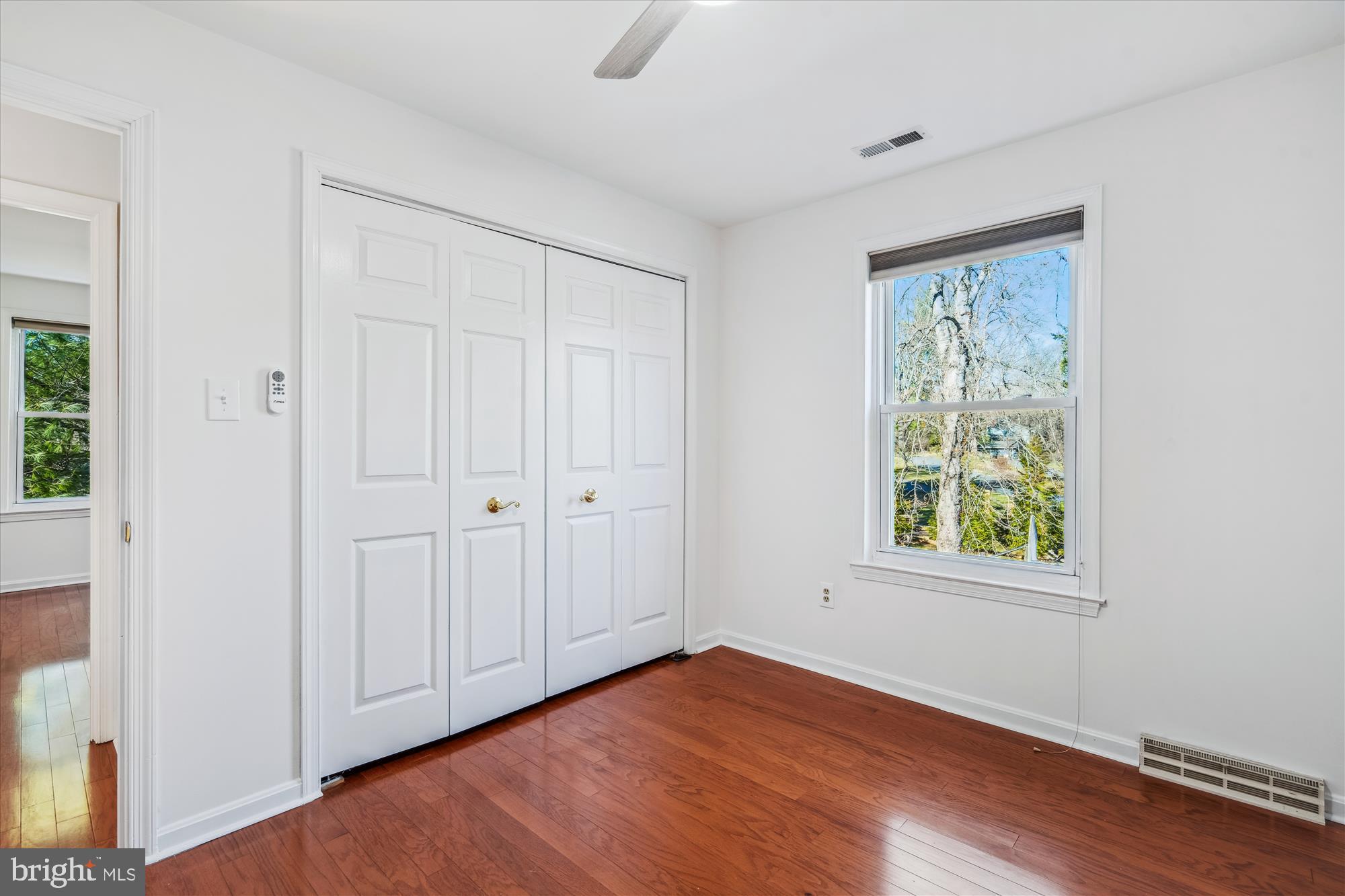4048 Arjay Circle Ellicott City, MD 21042 - Photo 30 of 56 a view of an empty room with wooden floor and a window