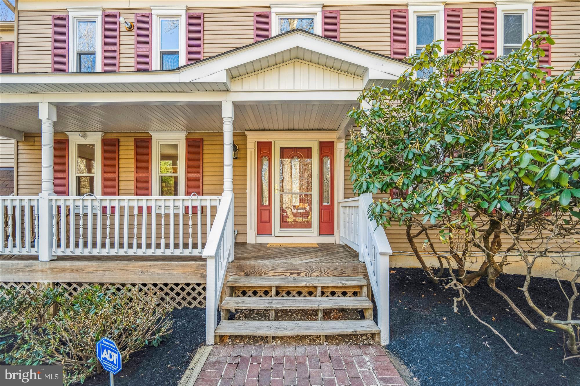 4048 Arjay Circle Ellicott City, MD 21042 - Photo 3 of 56 a front view of a house with a garden