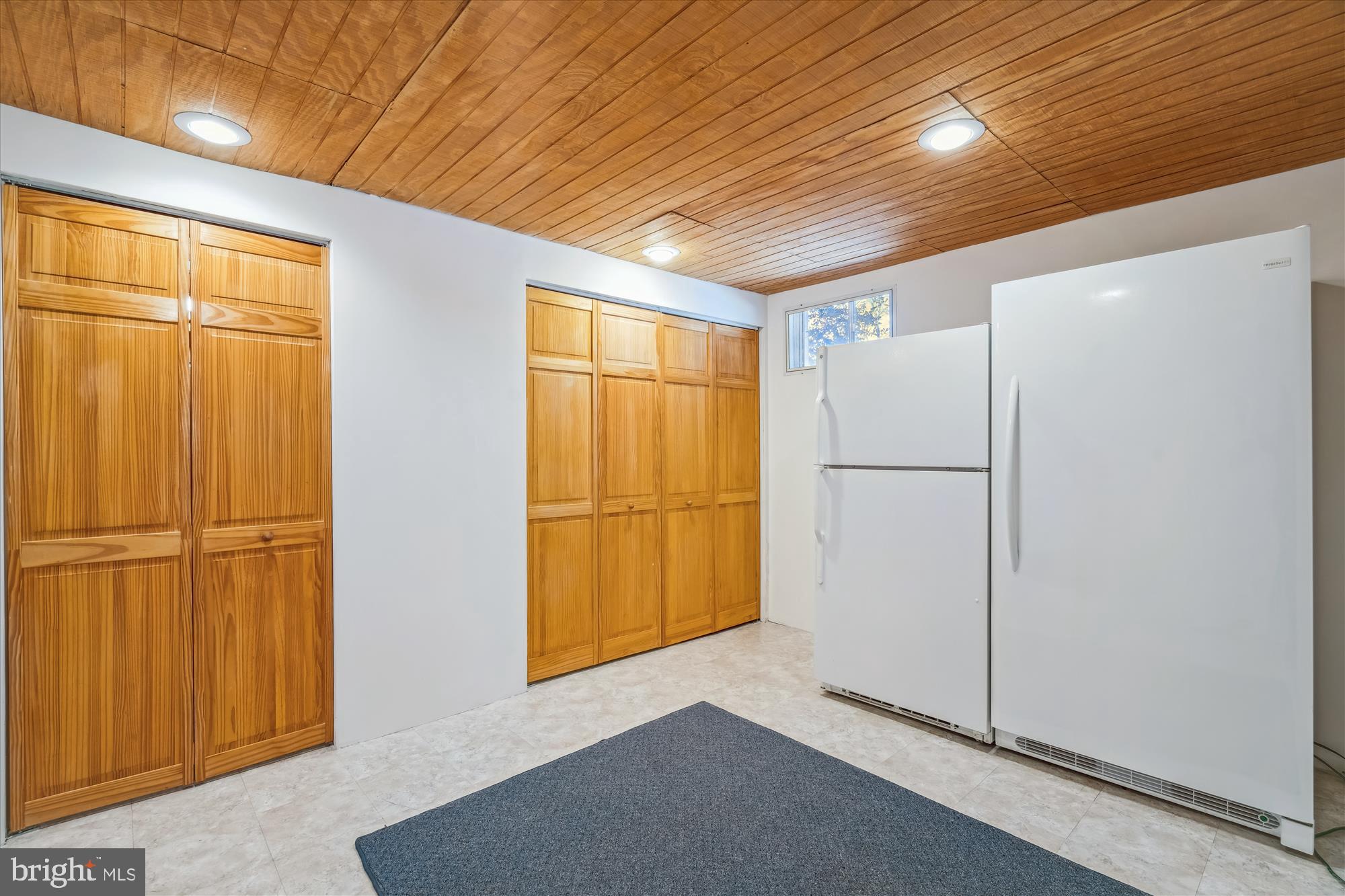 4048 Arjay Circle Ellicott City, MD 21042 - Photo 47 of 56 a view of a refrigerator in kitchen and wooden floor